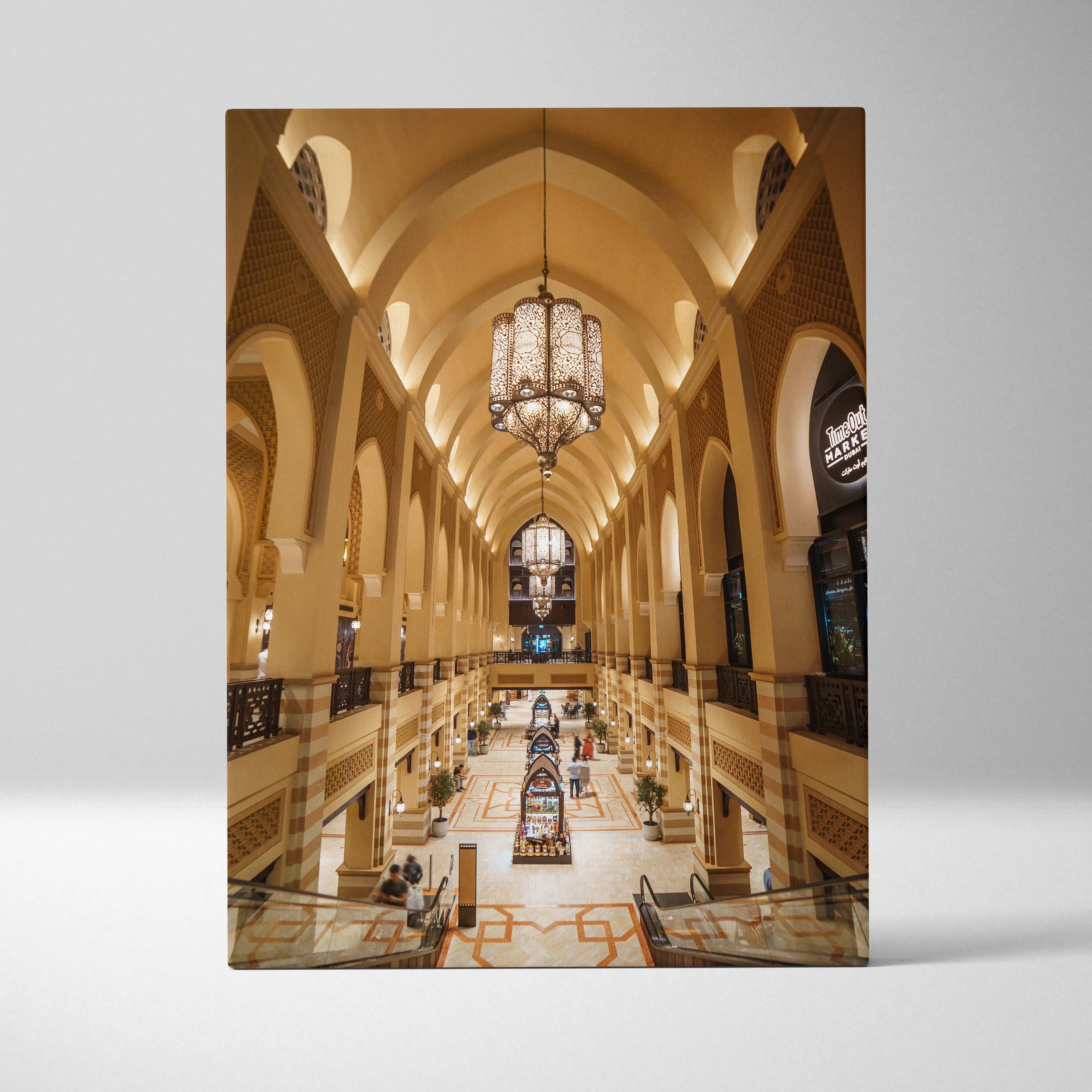Vertical canvas wall art of grand architectural interior with high arches and chandelier.