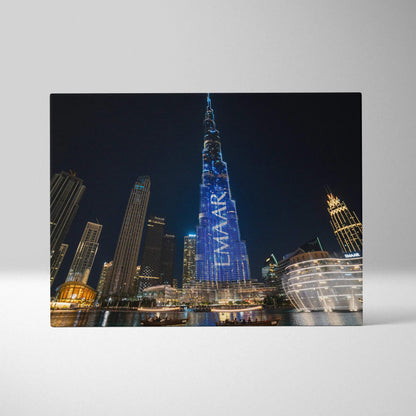 Canvas wall art featuring illuminated modern skyscrapers at night in a cityscape design.