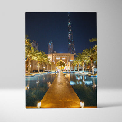 Vertical canvas art of illuminated Dubai architecture and urban nightscape reflected in water.
