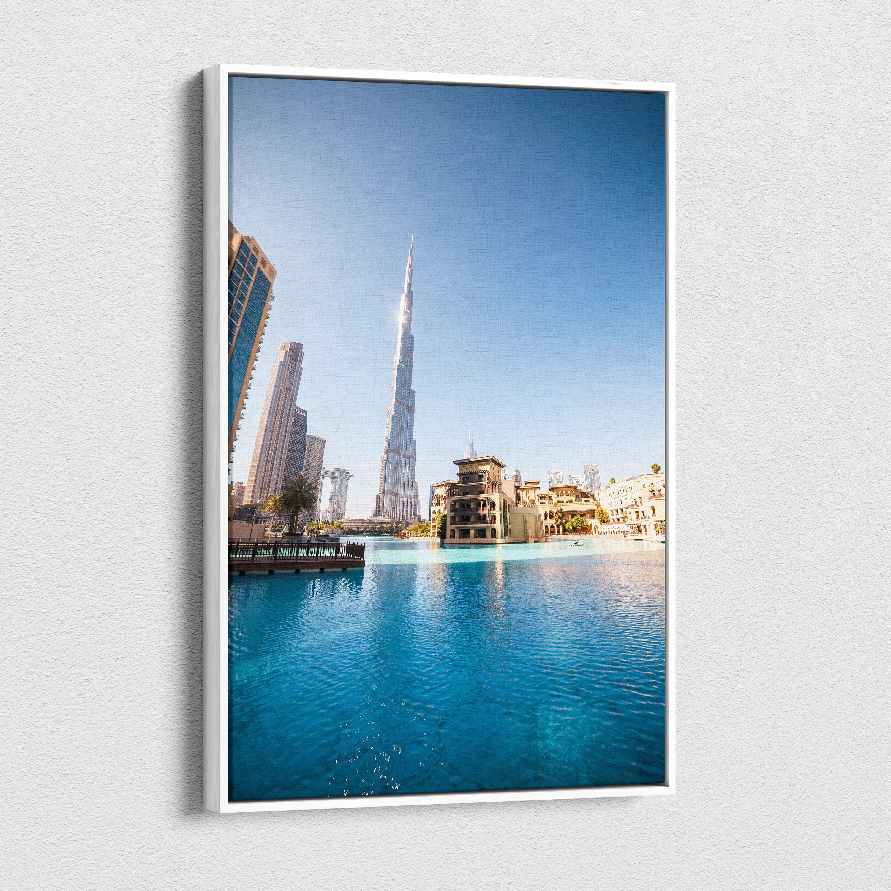Canvas wall art featuring a vibrant cityscape with iconic skyscrapers and clear blue water under a bright sky.