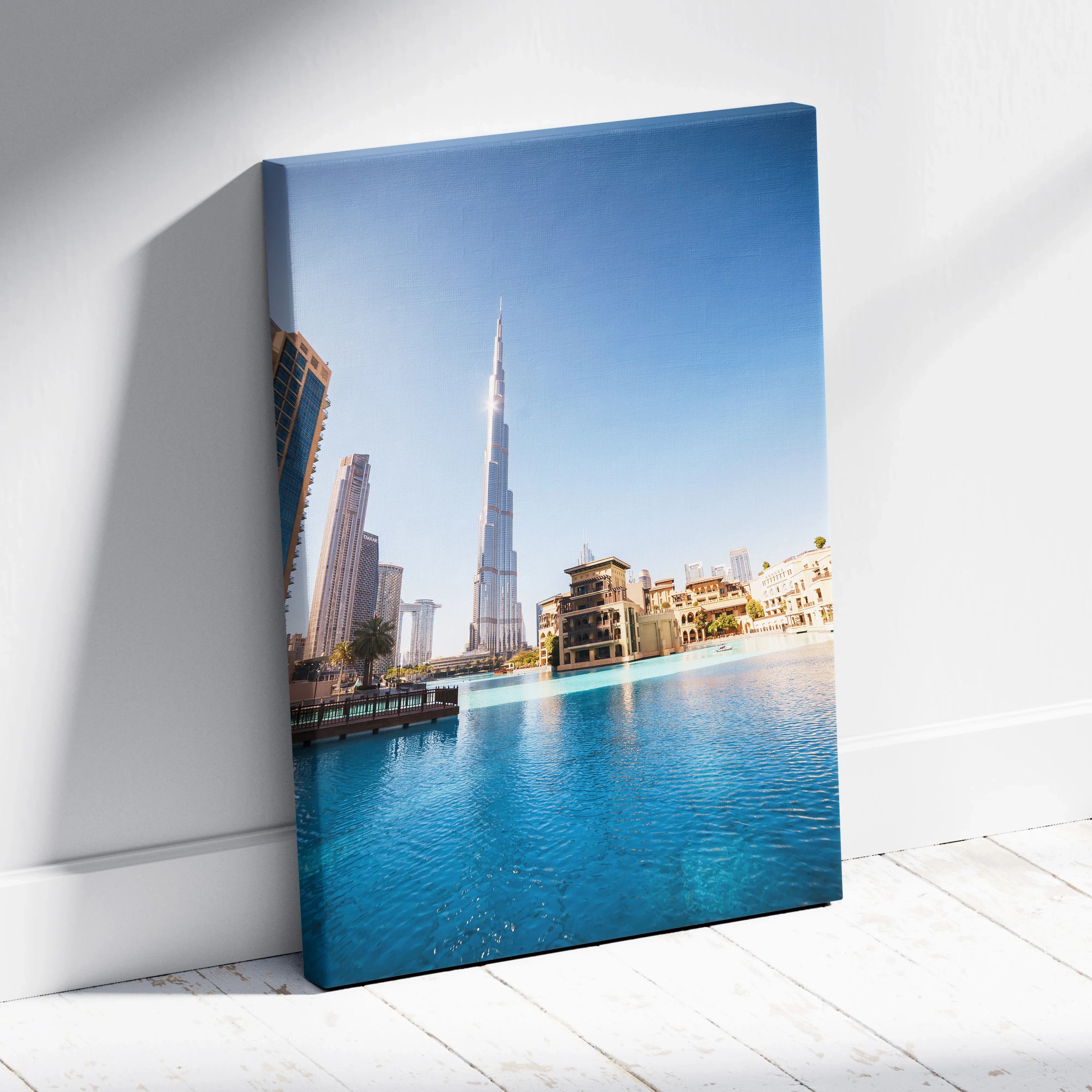 Vertical canvas wall art featuring iconic architecture with a city skyline and blue water reflection.