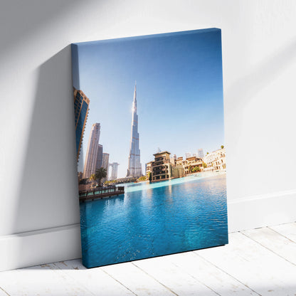 Vertical canvas wall art featuring iconic architecture with a city skyline and blue water reflection.