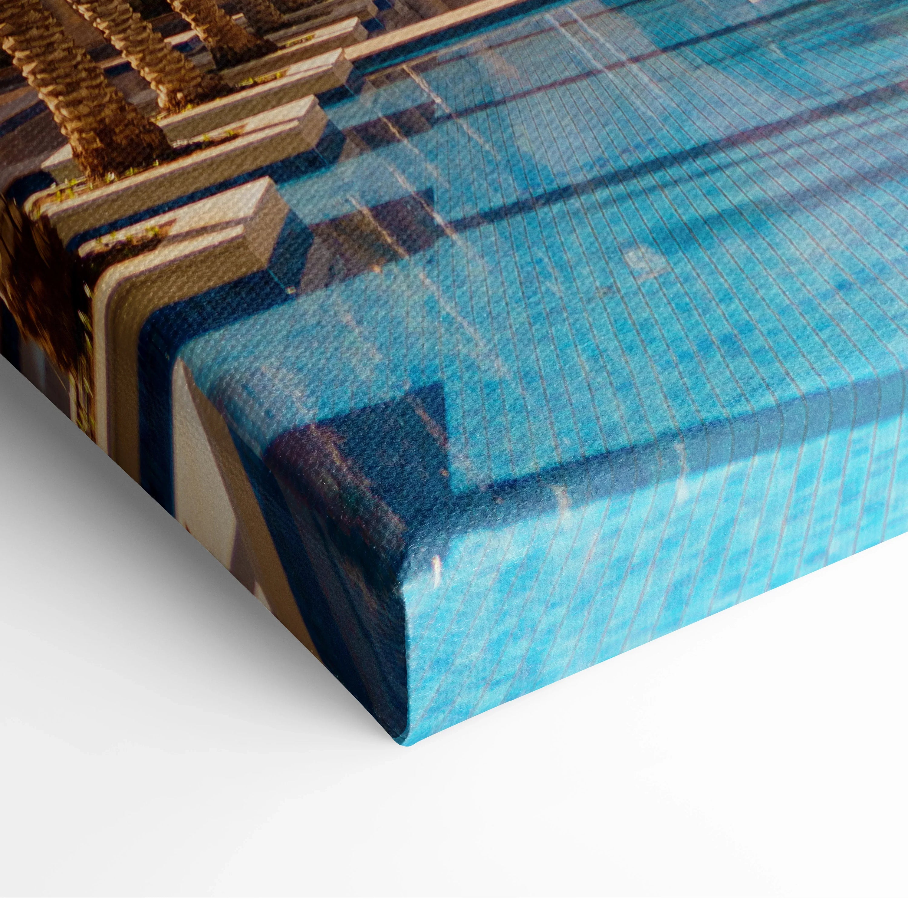 Close-up of vibrant blue and brown architectural digital design printed on textured canvas wrapped around slim wooden frame.