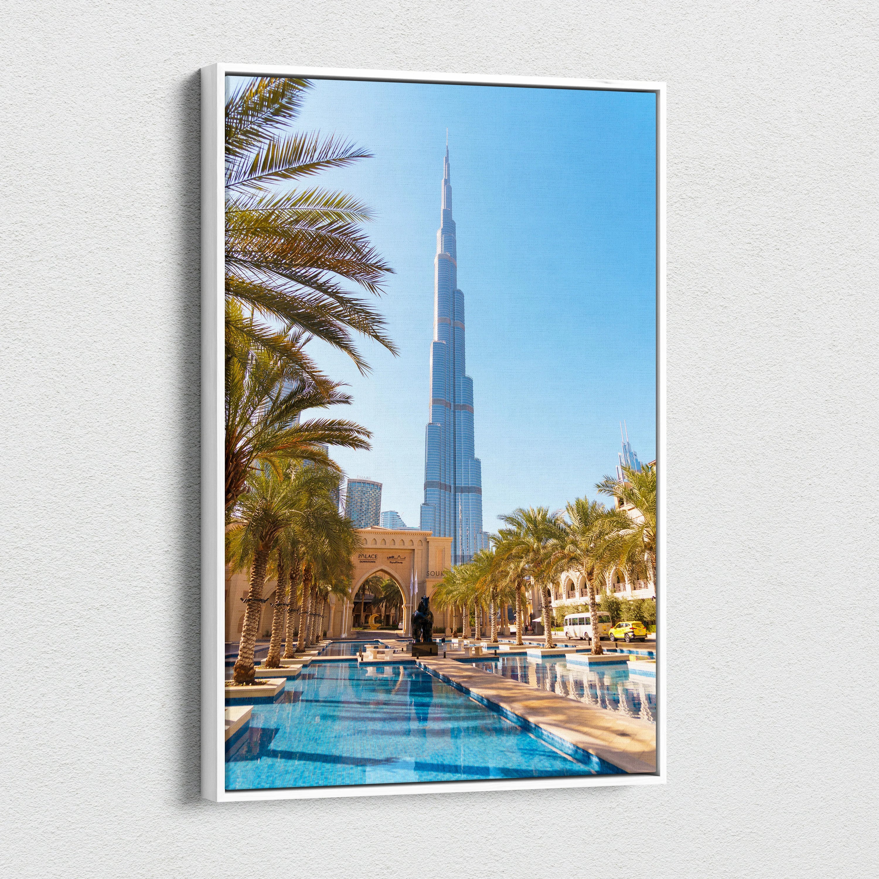 Vertical canvas art wall decor featuring a high-resolution architectural print of Burj Khalifa with palm trees and.