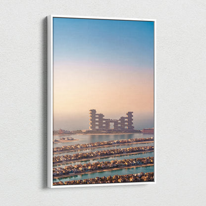 Canvas wall art featuring a high-resolution digital print of futuristic buildings at sunset with soft blue and orange tones.