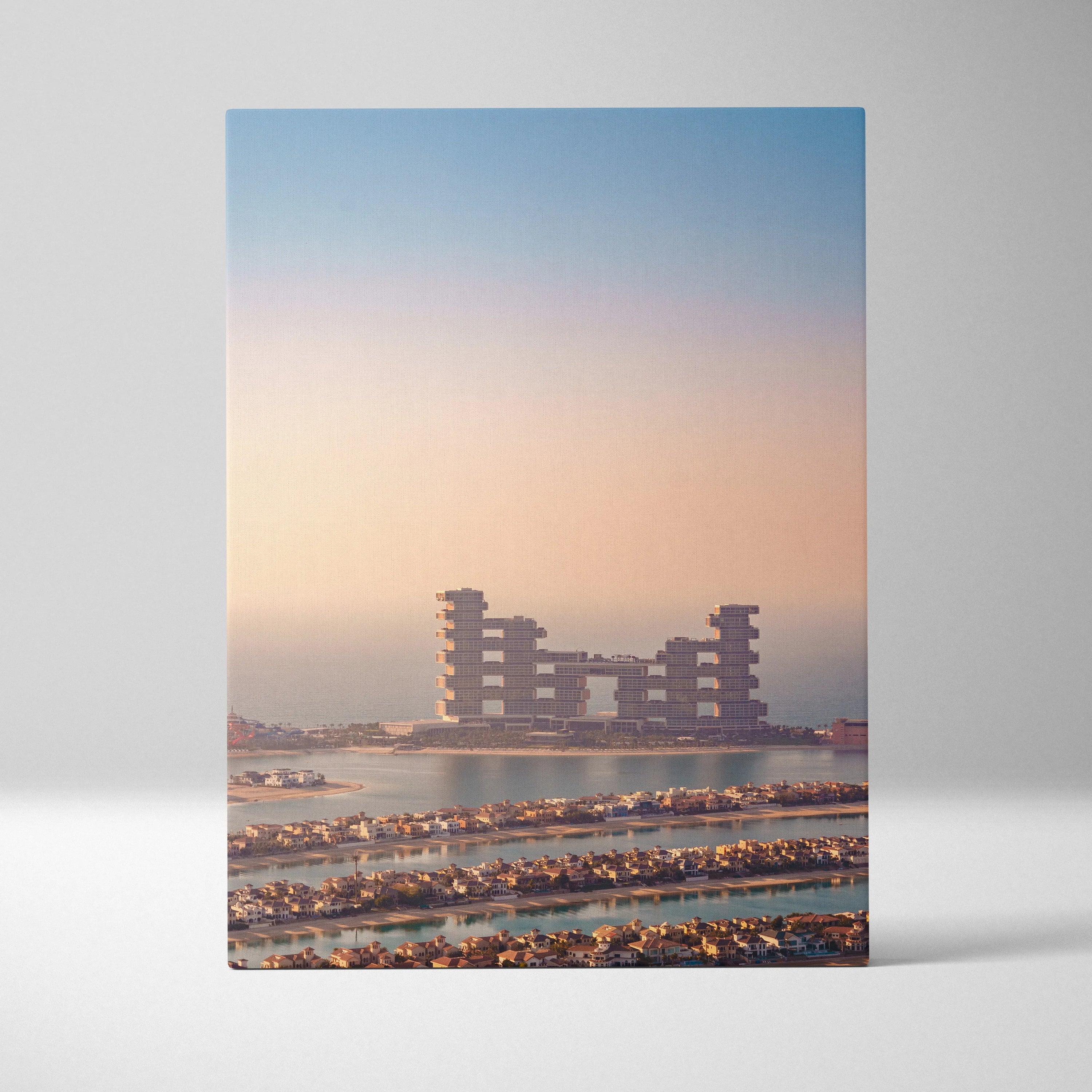Canvas wall art featuring high-resolution digital print of modern architectural buildings against a soft gradient sky at.