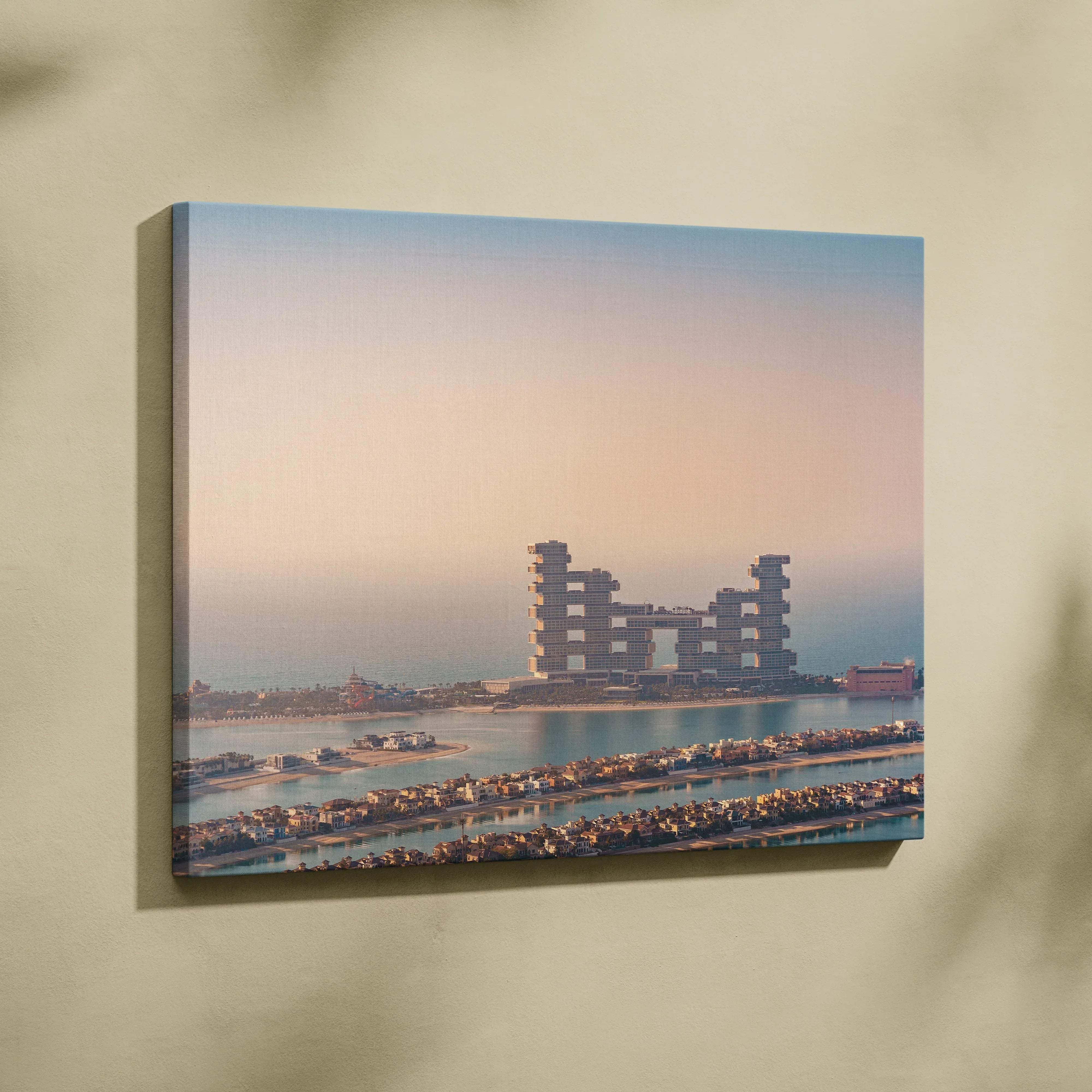Rectangular canvas print of modern tiered architecture with warm pastel sunset coastal skyline colors over water