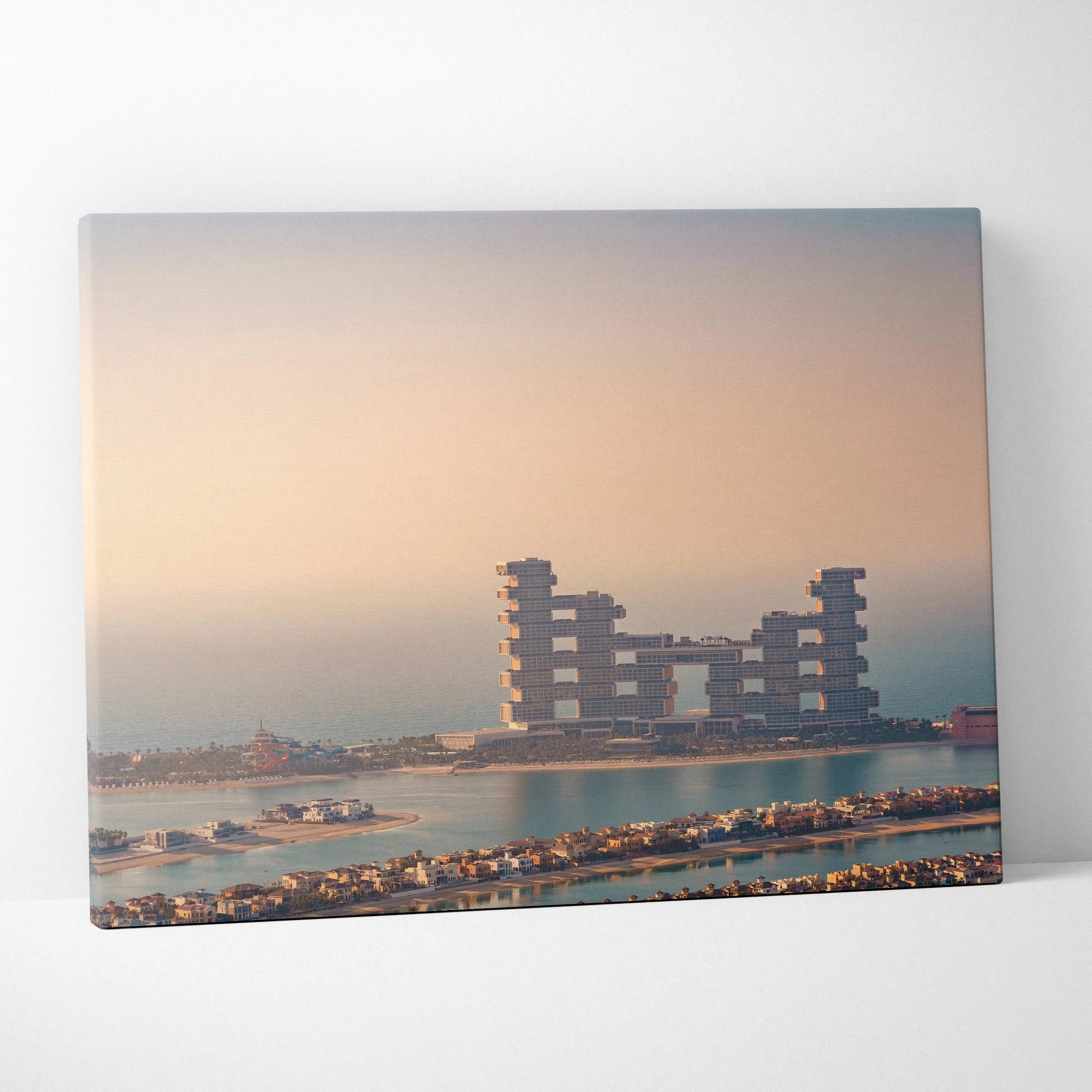 Canvas wall art featuring digital architecture of block-style buildings on water during sunset with soft pastel sky.
