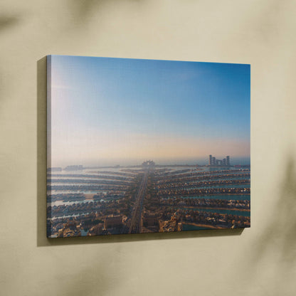 Canvas wall art featuring an aerial view of a coastal cityscape at sunrise with modern buildings and water channels.