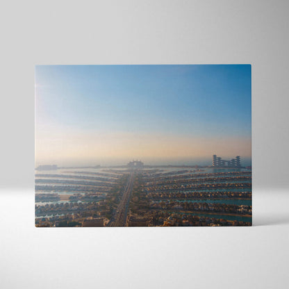 Canvas wall art featuring a digital cityscape with buildings and a clear blue sky at sunrise or sunset.