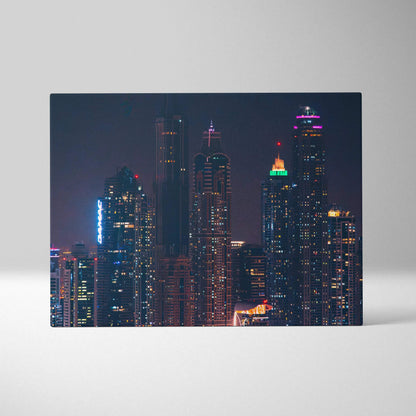 High-resolution canvas art featuring a vivid nighttime city skyline with illuminated skyscrapers and colorful lights against