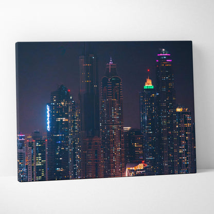 High-resolution canvas art of illuminated modern city skyscrapers at night, wall art with digital architecture design.