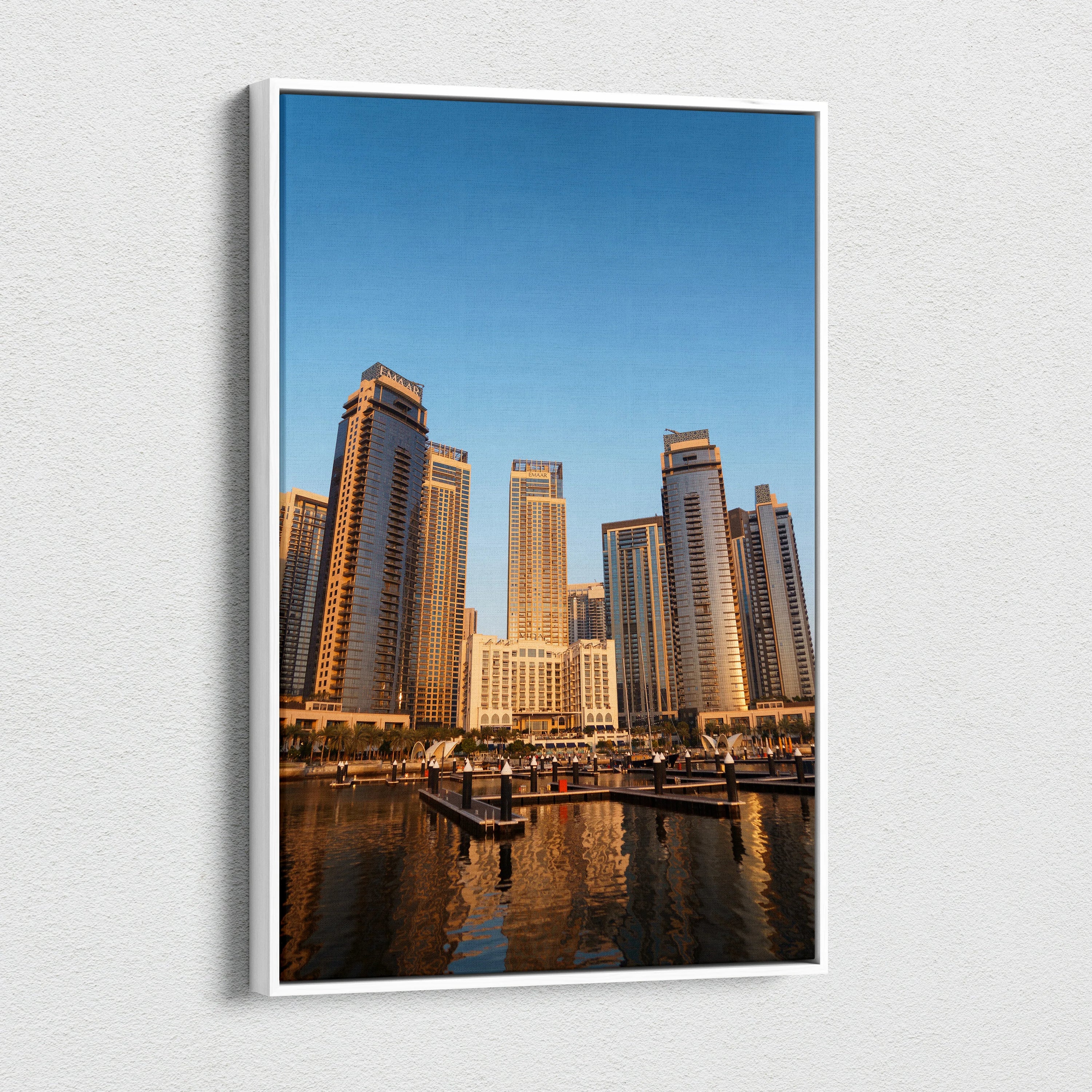 Vertical canvas wall art featuring modern skyscrapers with clear blue sky background for elegant home decor.