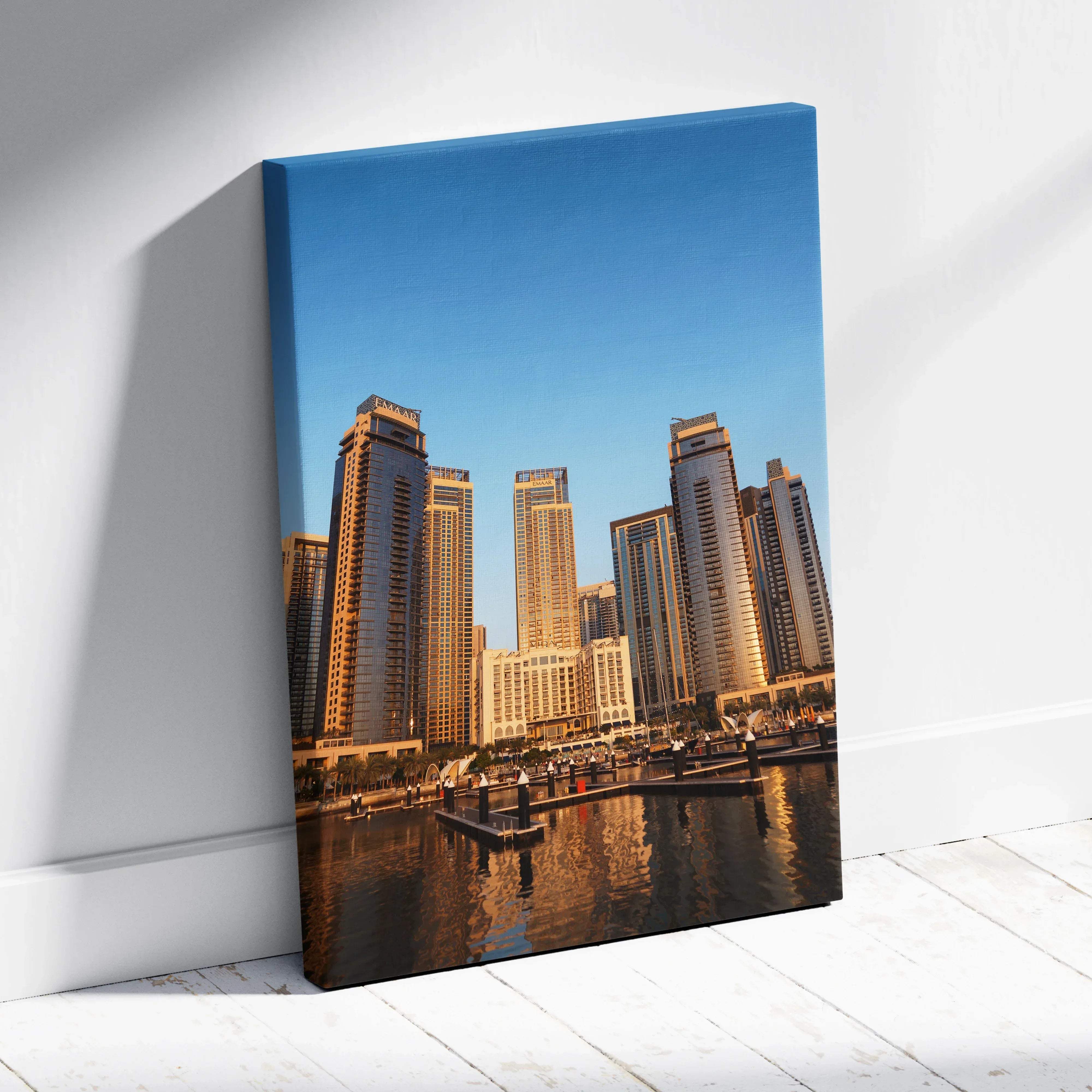 Modern urban skyline canvas wall art featuring tall glass skyscrapers reflecting in calm water under clear blue sky