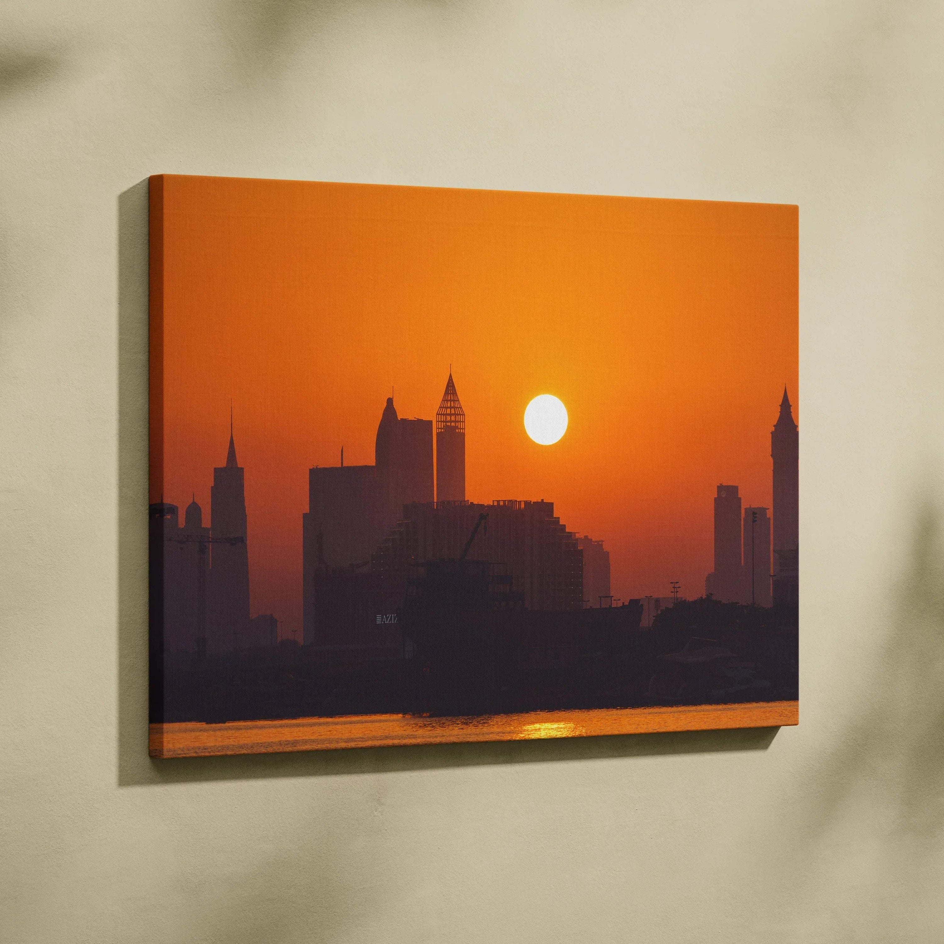 Sunset city skyline canvas wall art with warm orange tones and silhouetted buildings.