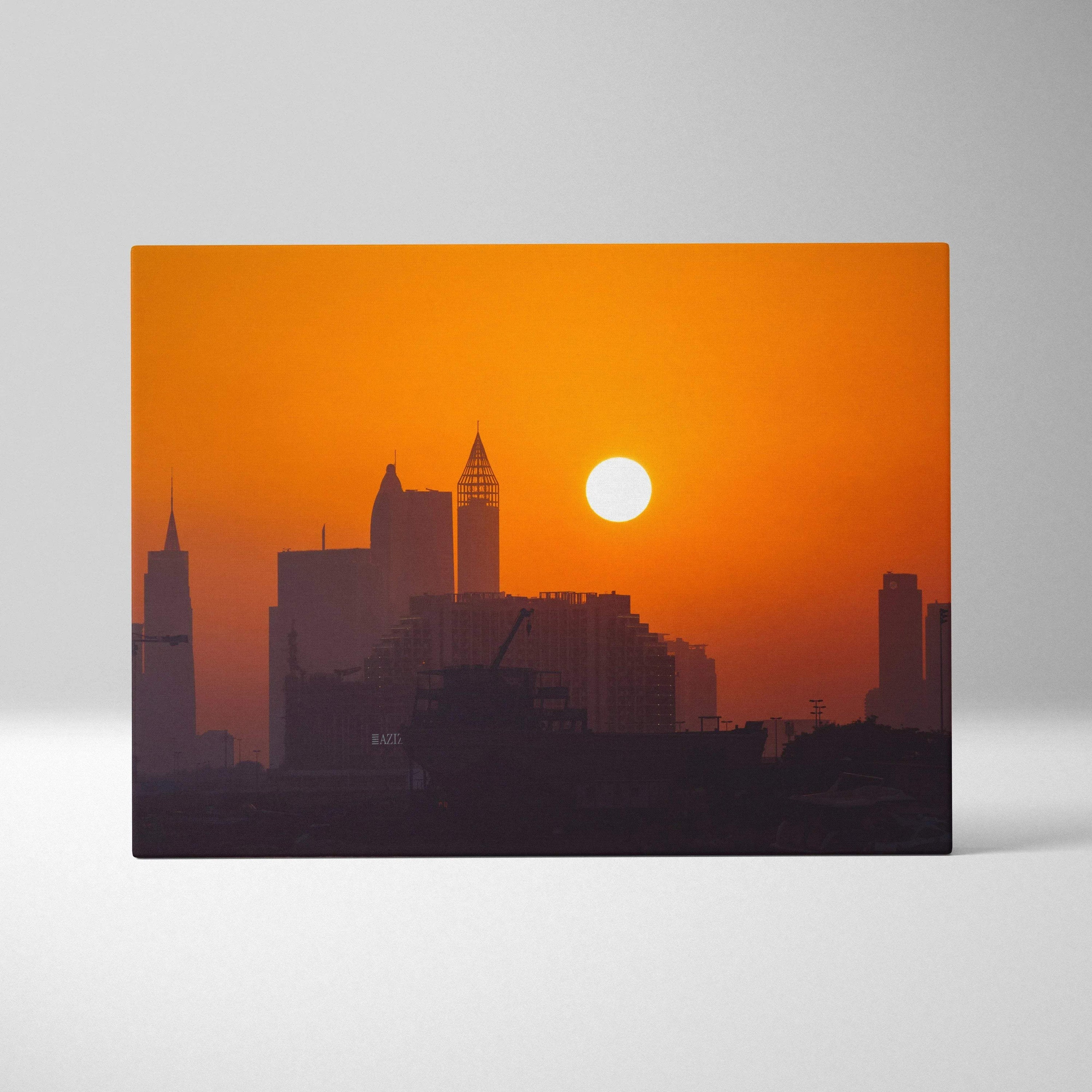 Canvas wall art featuring a digital art city skyline silhouette with an orange sunset background.