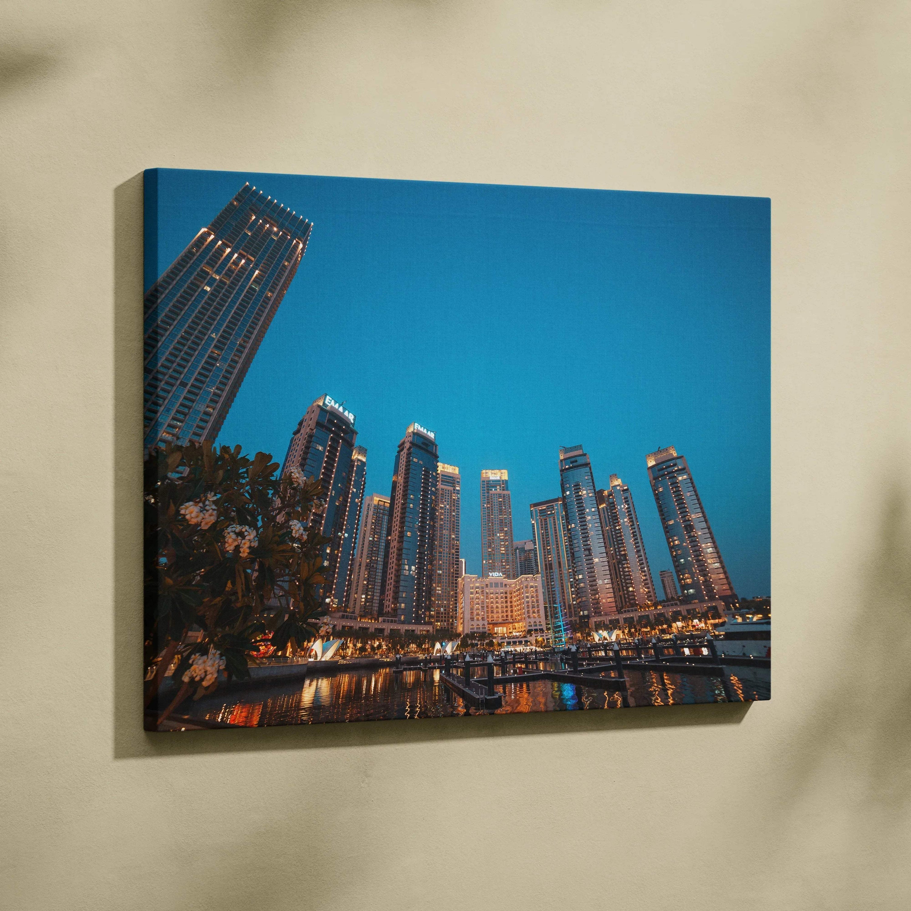 Canvas wall art featuring illuminated high-rise buildings against a clear evening sky.