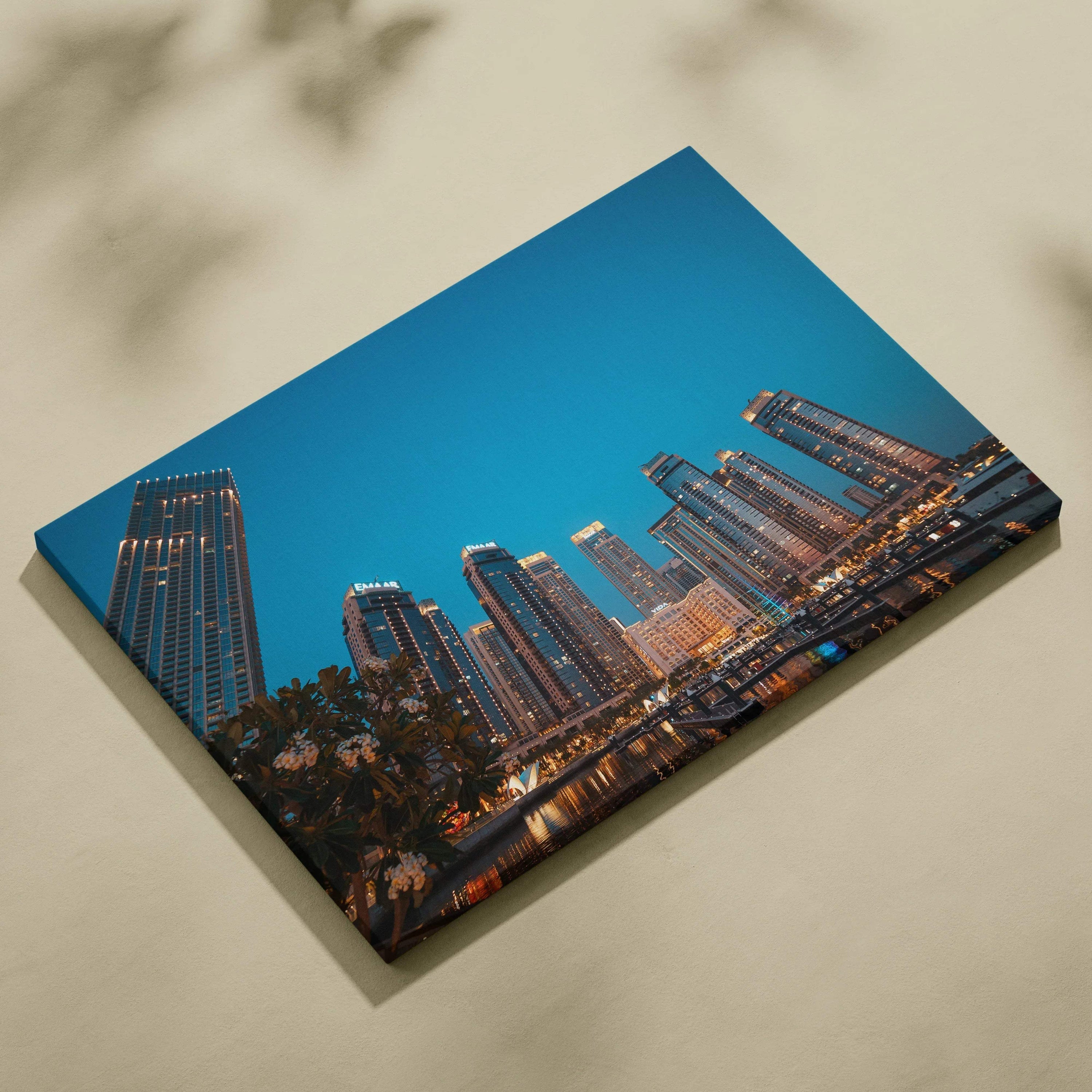 Canvas wall art featuring a digital cityscape with modern skyscrapers against a deep blue sky at dusk.