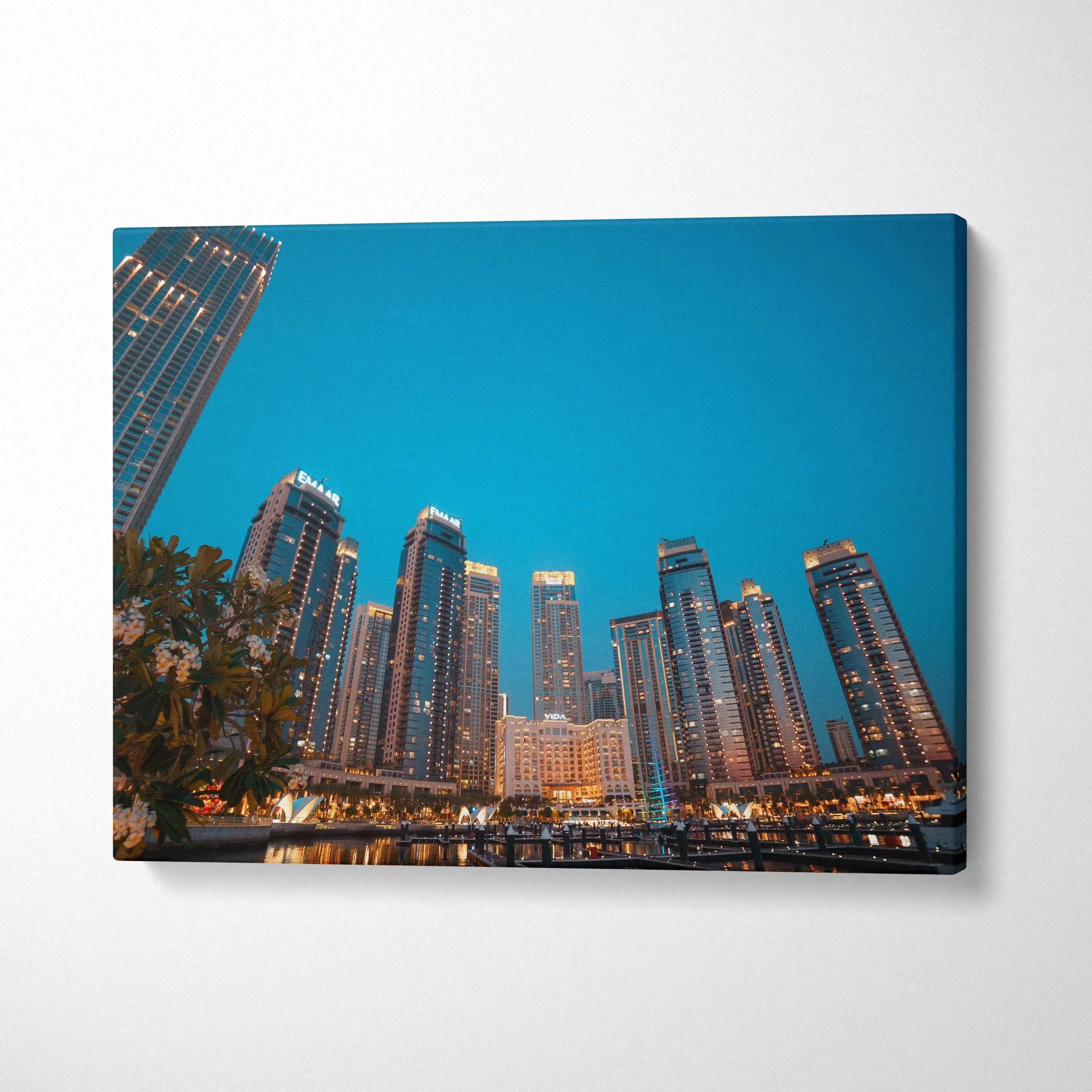City skyline with illuminated modern skyscrapers at dusk on canvas wall art print.
