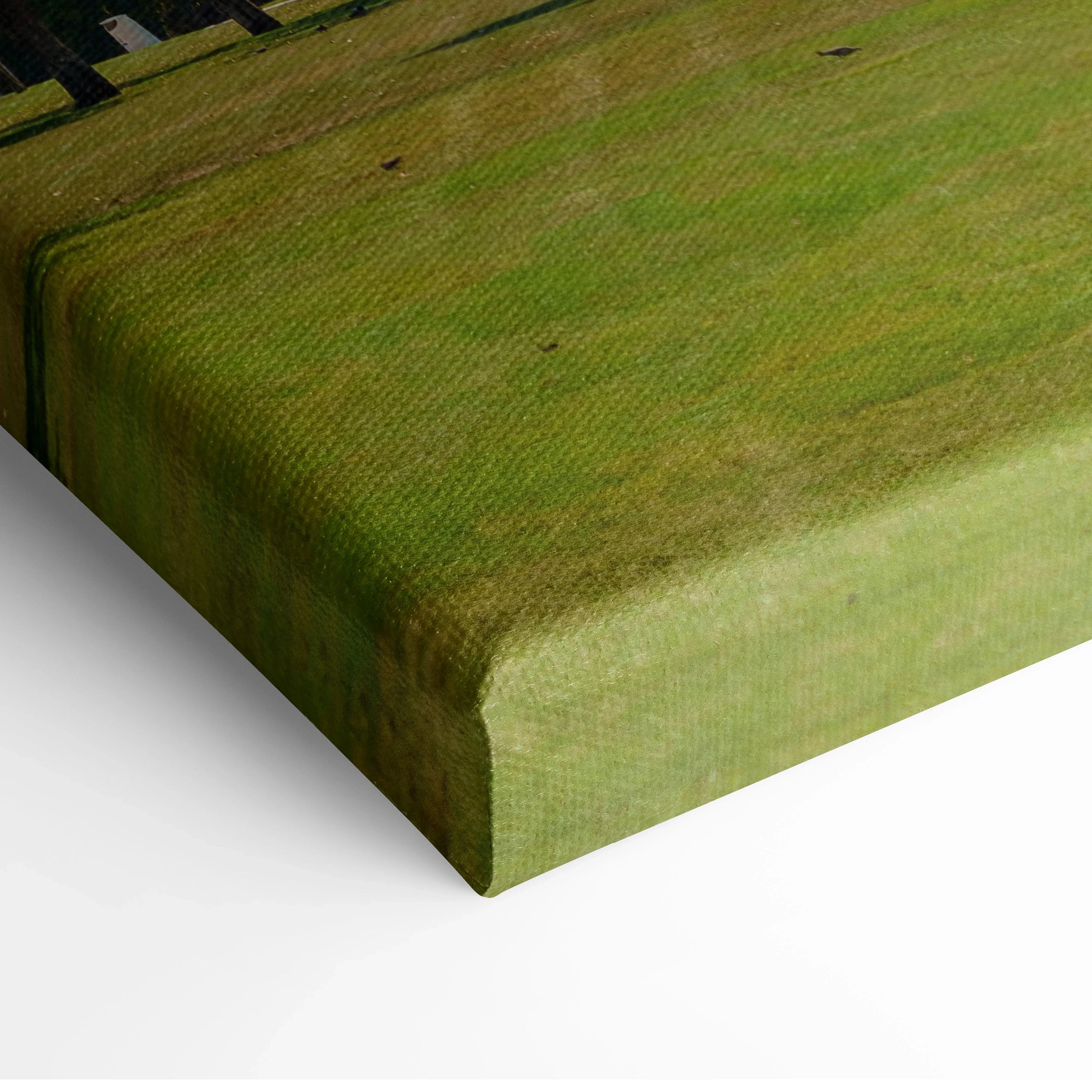 Close-up of textured canvas art with green and brown tones, stretched over wooden frame for wall mounting.