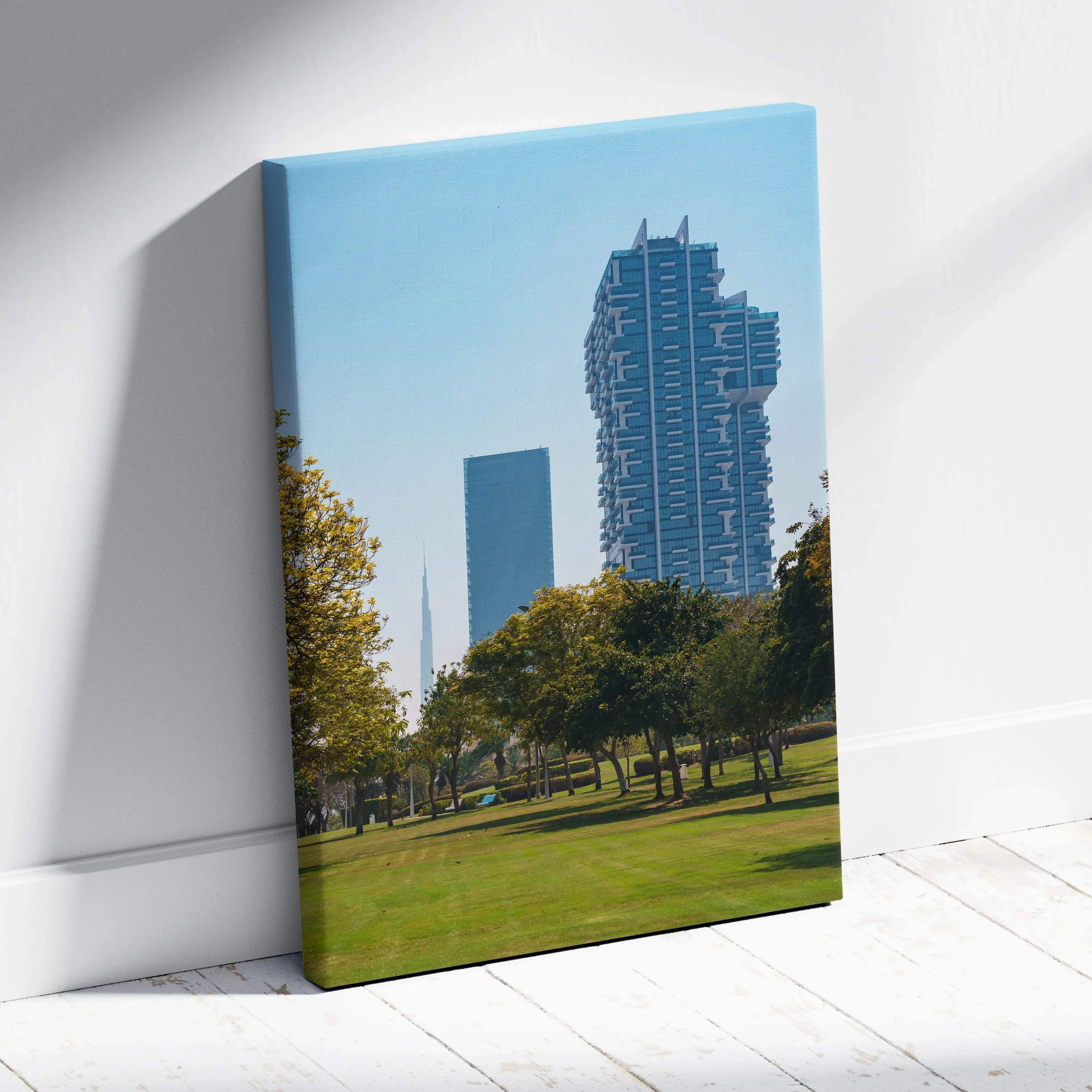 Blue and green cityscape canvas wall art featuring modern skyscrapers and trees in calm blue tones