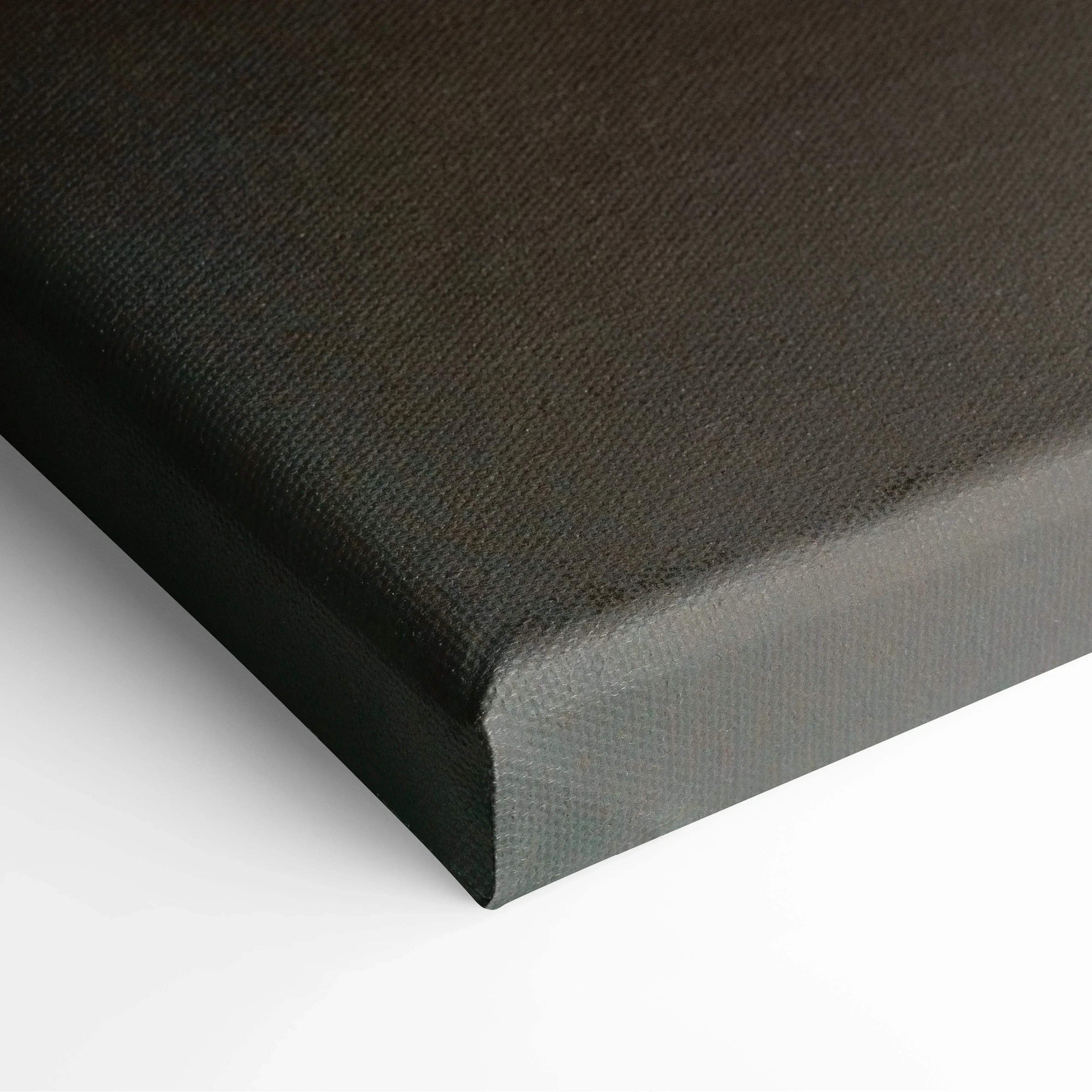 Close-up of black textured canvas corner on stretched frame for wall art decor.