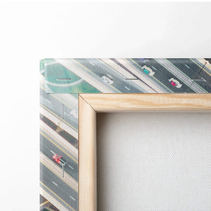 Close-up of corner showing beige wooden frame with stretched textured canvas and printed abstract architectural design in.