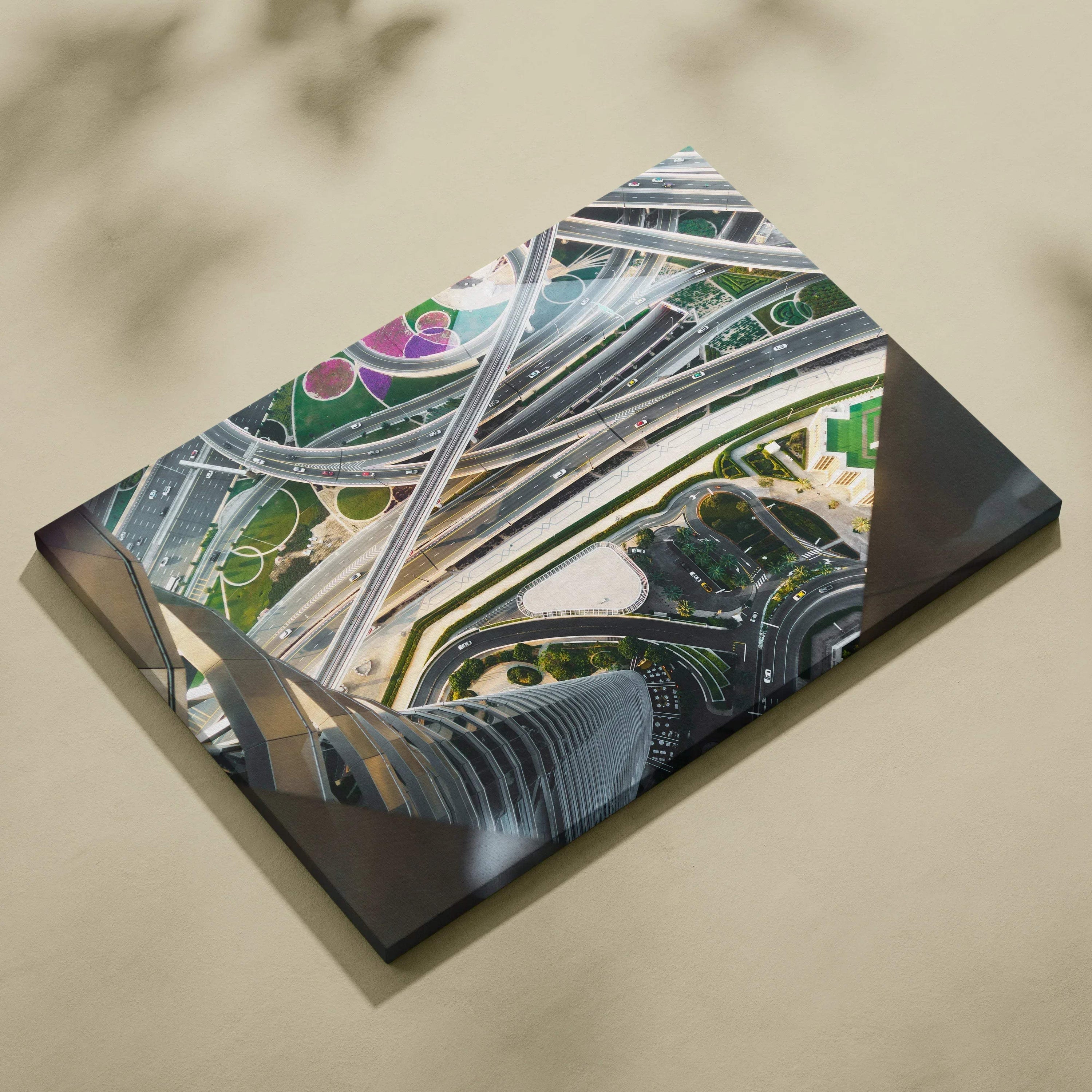 Aerial view of intricate modern highway interchanges printed on a rectangular canvas wall art with vibrant colors and.