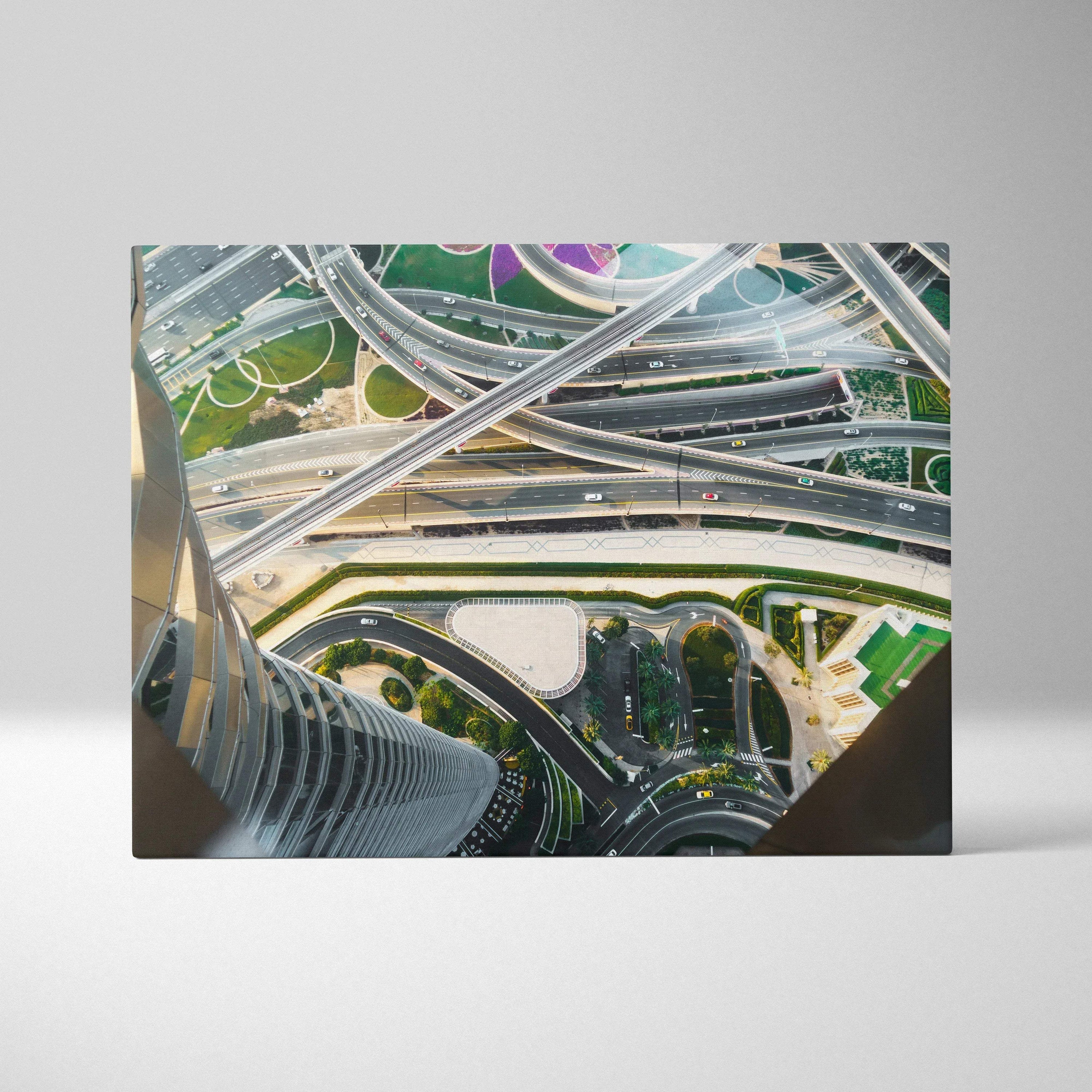Canvas wall art print featuring an aerial view of futuristic architecture and intersecting highways in vibrant colors.