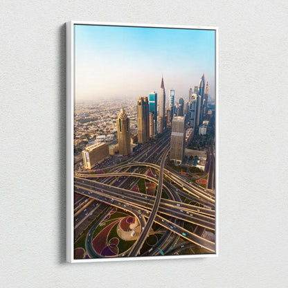 Modern cityscape canvas wall art featuring skyscrapers and intricate highway overpasses in warm sunlight.