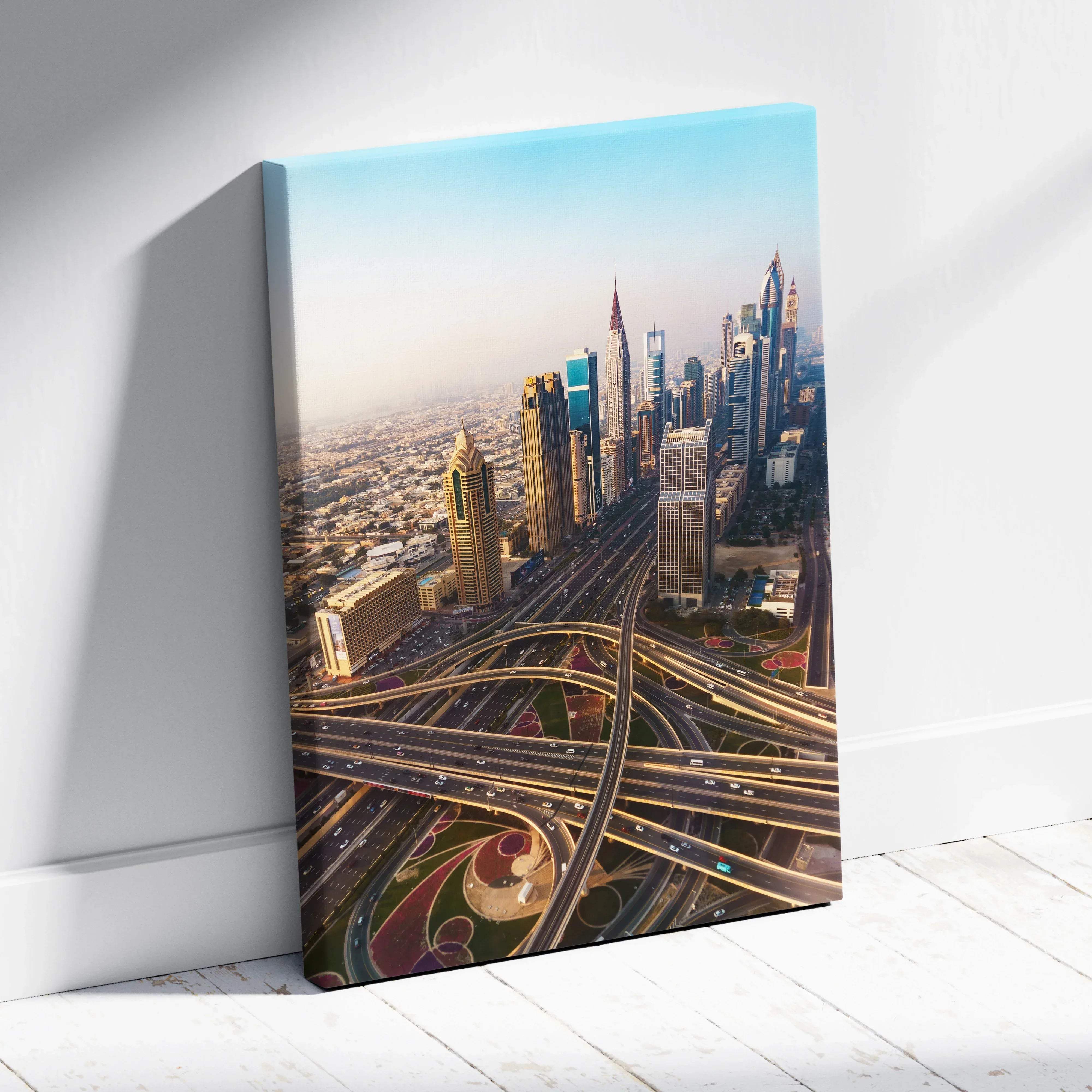 A vibrant canvas print of a modern cityscape with gold and blue skyscrapers and intricate highway intersections