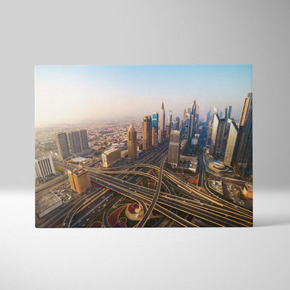 Canvas wall art featuring a vibrant aerial view of a modern city skyline with intricate highway interchanges under a clear.