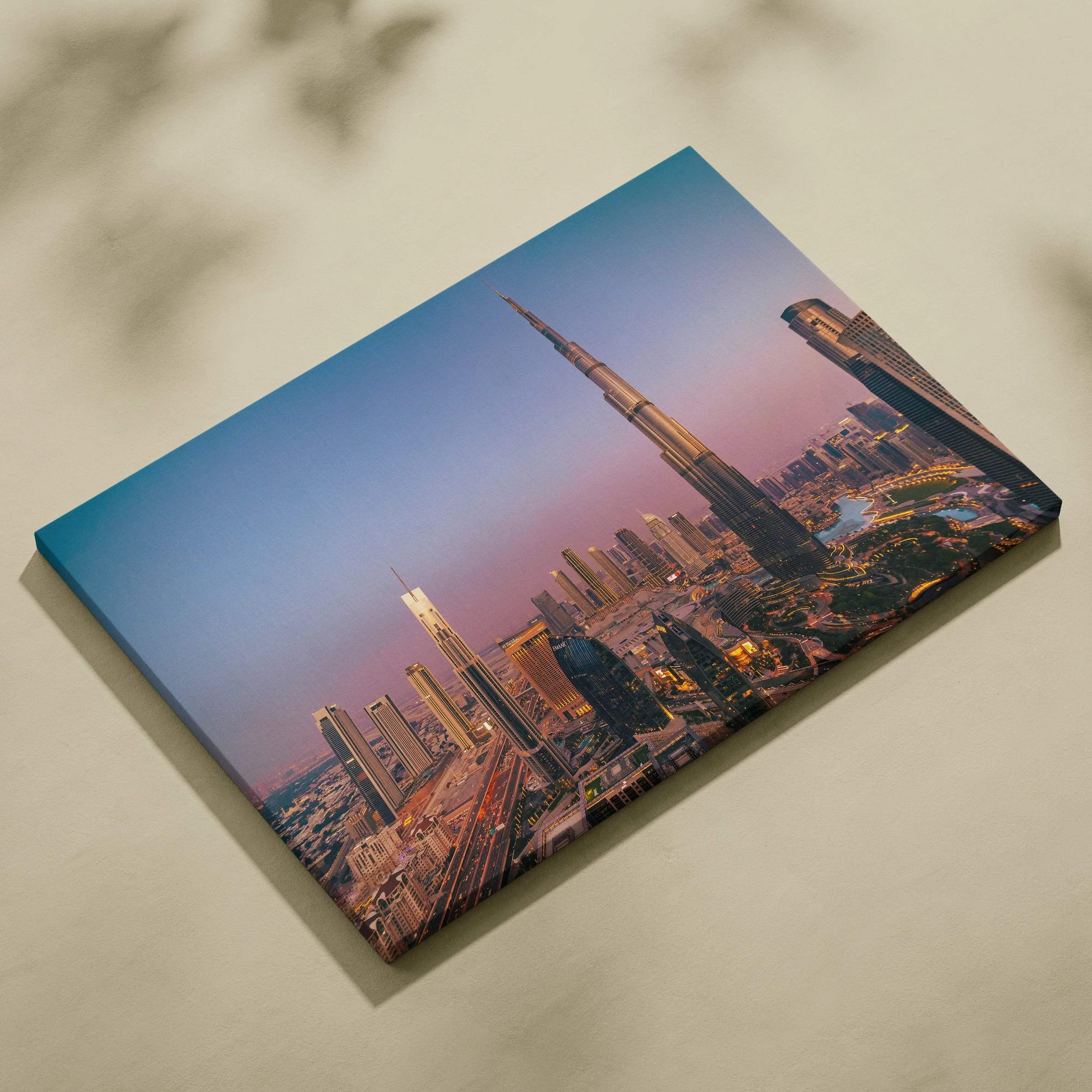 Canvas wall art featuring a city skyline with modern skyscrapers at sunset, emphasizing the tallest building.