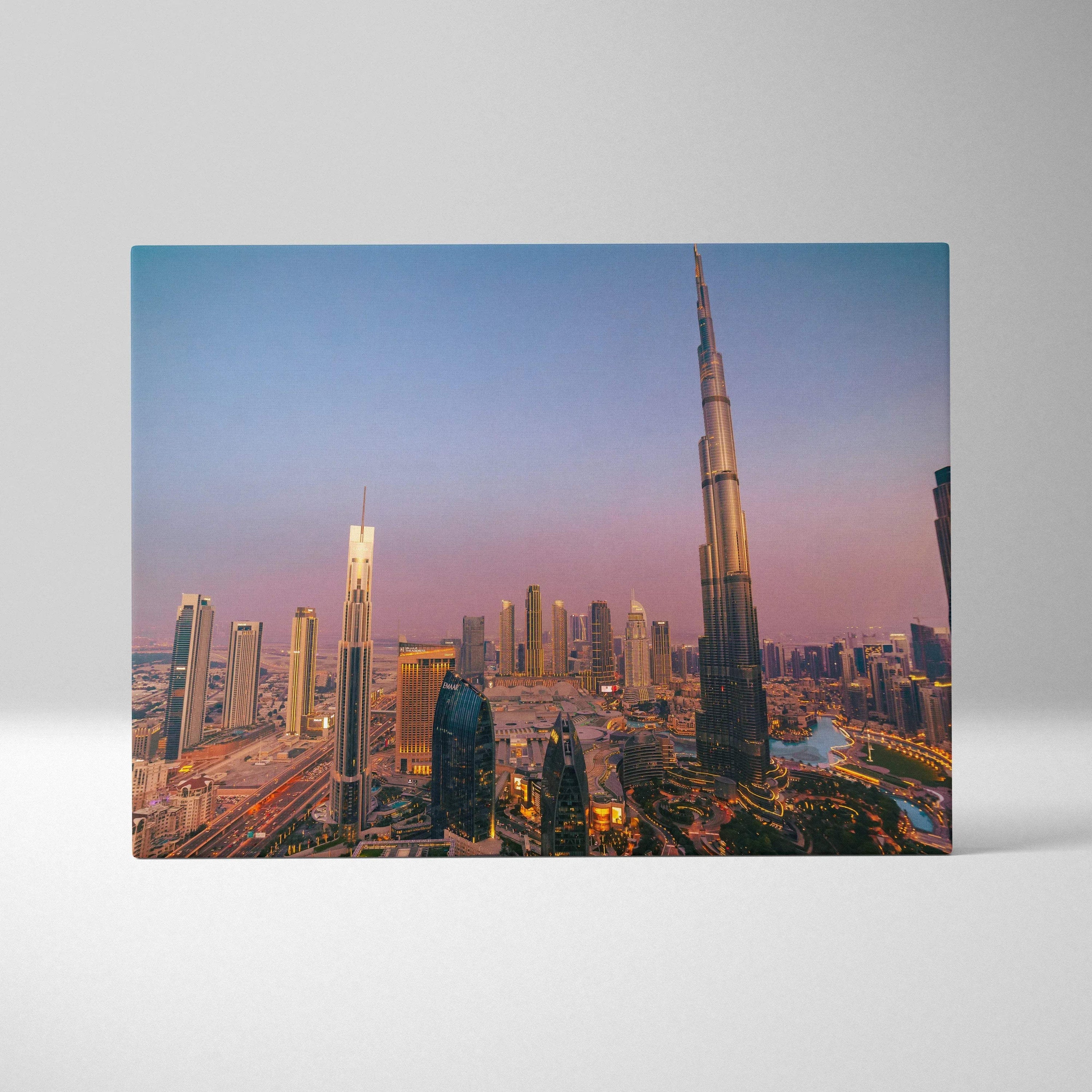 Canvas wall art featuring a vibrant cityscape with modern skyscrapers at sunset, including a tall, illuminated tower against