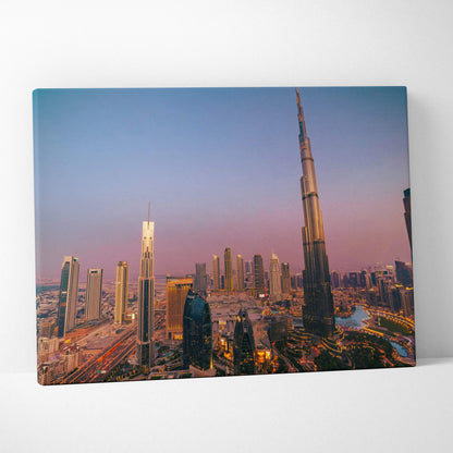 Canvas wall art featuring a vibrant city skyline at dusk with modern skyscrapers, including a tall, slender tower against a.