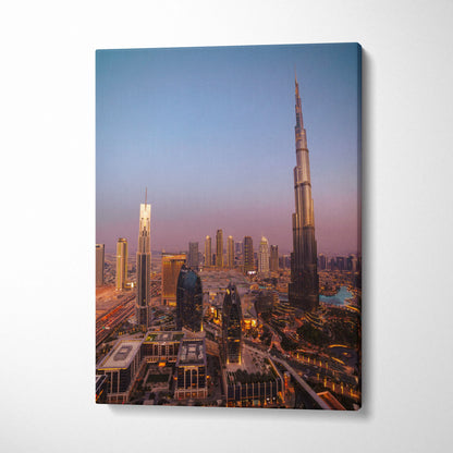 Canvas wall art featuring a vertical cityscape at dusk with iconic skyscrapers and glowing lights.