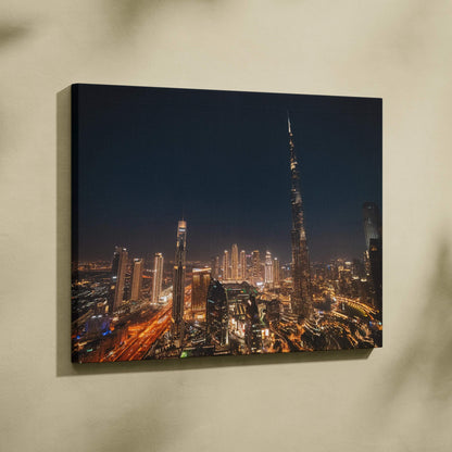 Nighttime cityscape featuring illuminated skyscrapers on a canvas wall art with dark blue sky background.