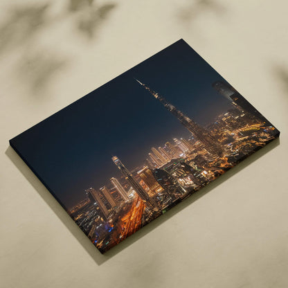 Nighttime cityscape digital art on stretched canvas with illuminated skyscrapers and dark sky.