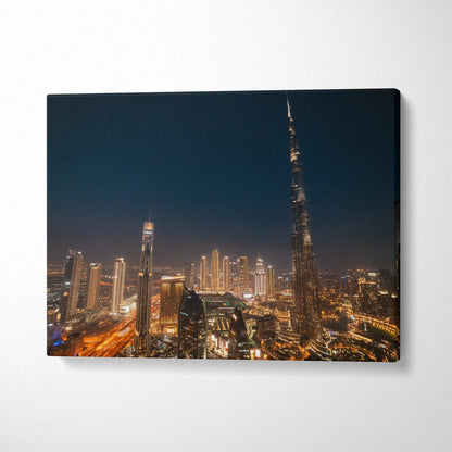 Nighttime cityscape canvas wall art print featuring illuminated skyscrapers and the Burj Khalifa tower.