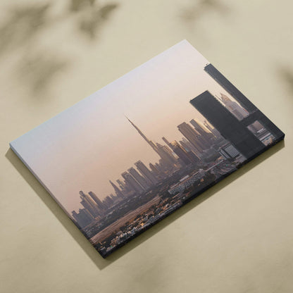 Canvas wall art featuring a sleek city skyline with tall buildings at sunset in soft muted tones.