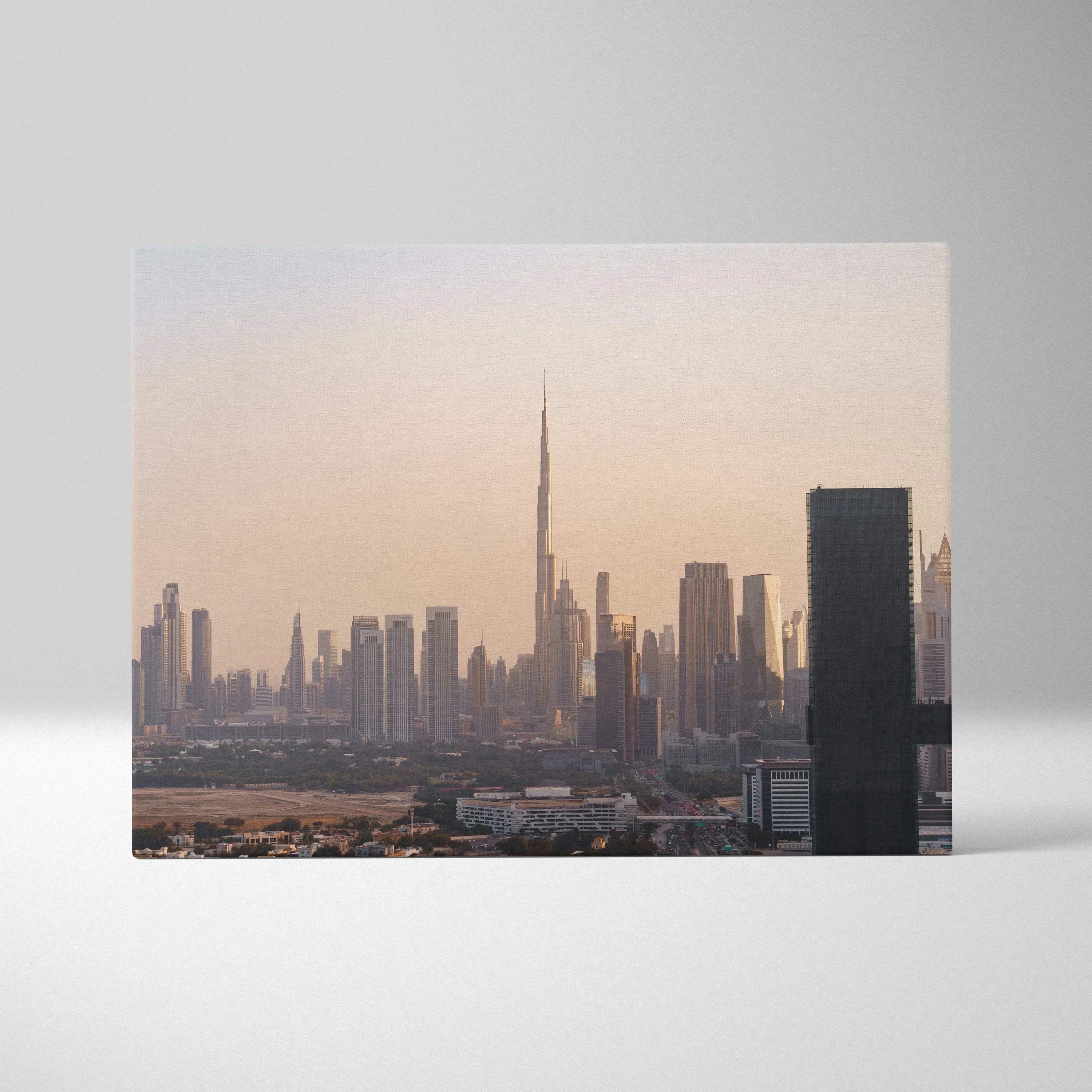 Canvas wall art featuring a soft pastel city skyline with a prominent tall skyscraper at sunset.