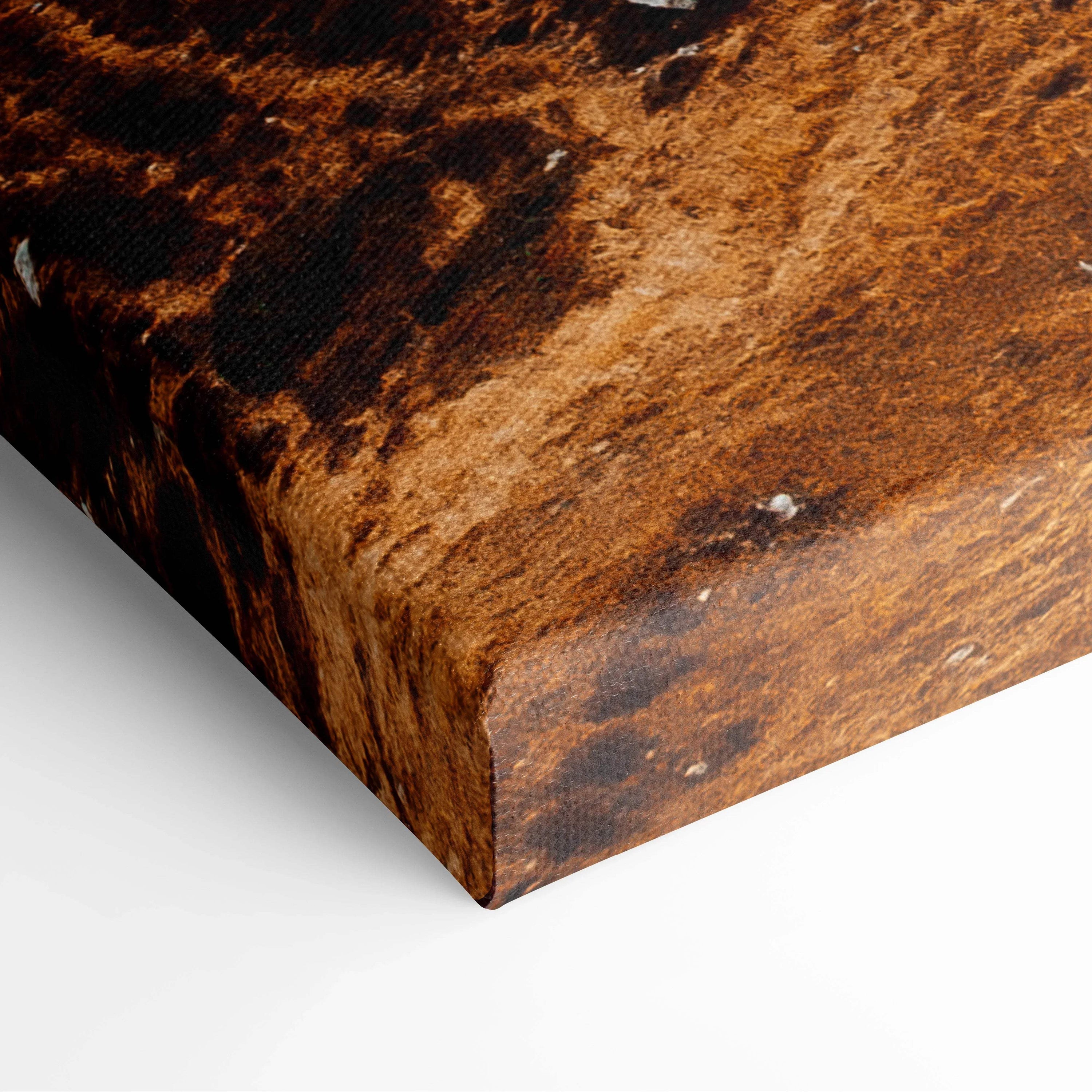 Close-up of canvas wall art corner with rich brown autumn texture and subtle wood grain detail.