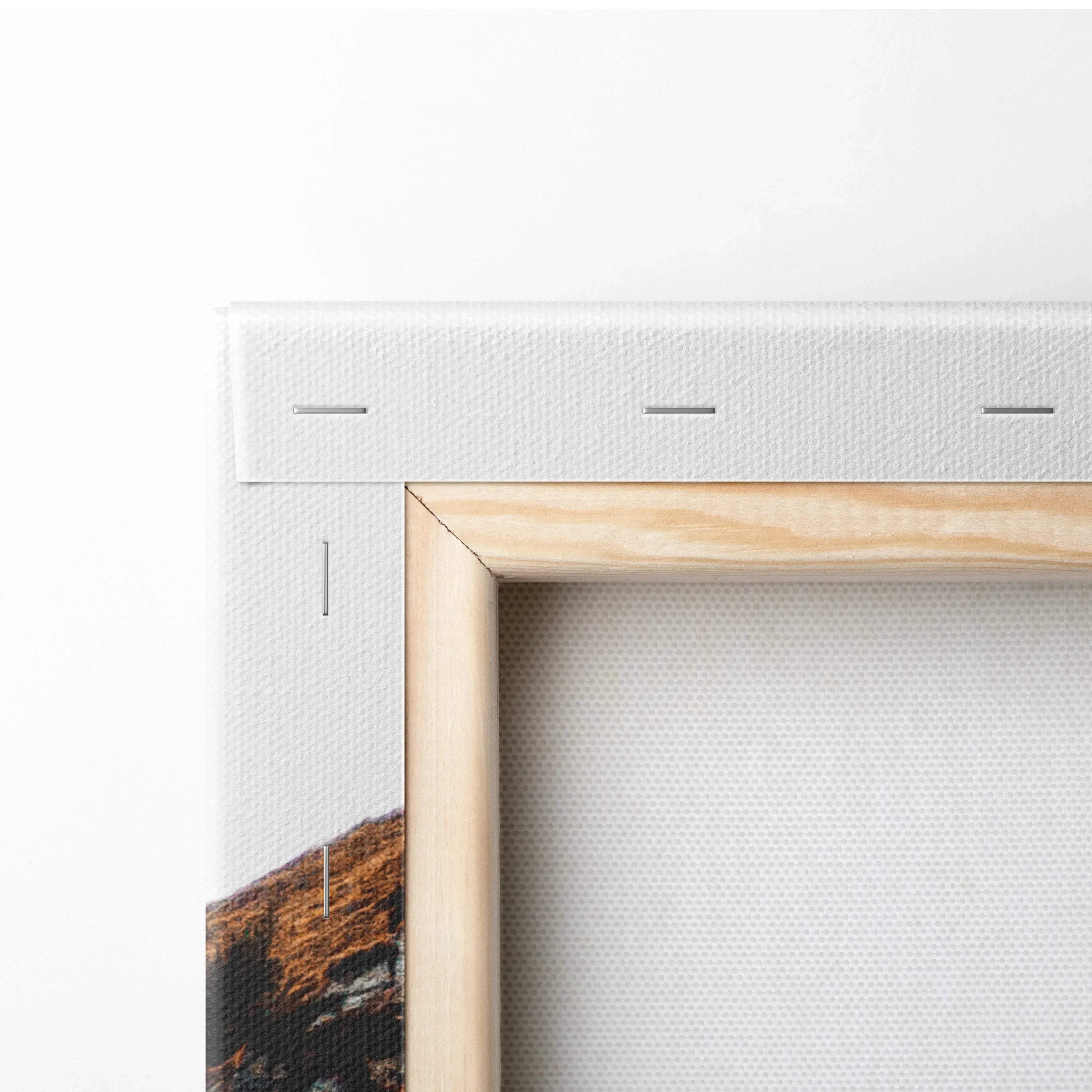 Close-up of wooden frame corner and white canvas texture on fall foliage wall art canvas art.