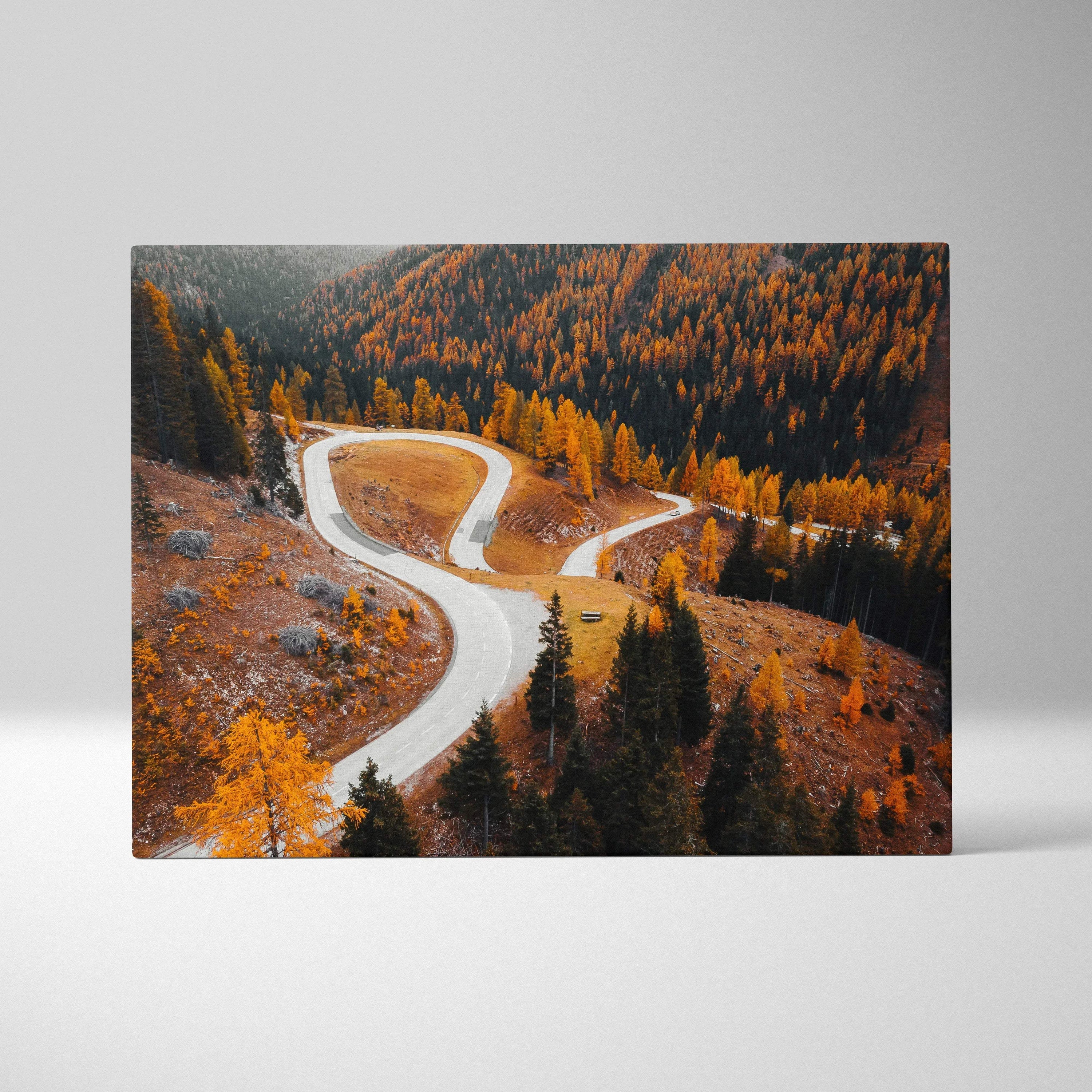 Autumn landscape canvas art with winding road and golden trees in vibrant fall colors.