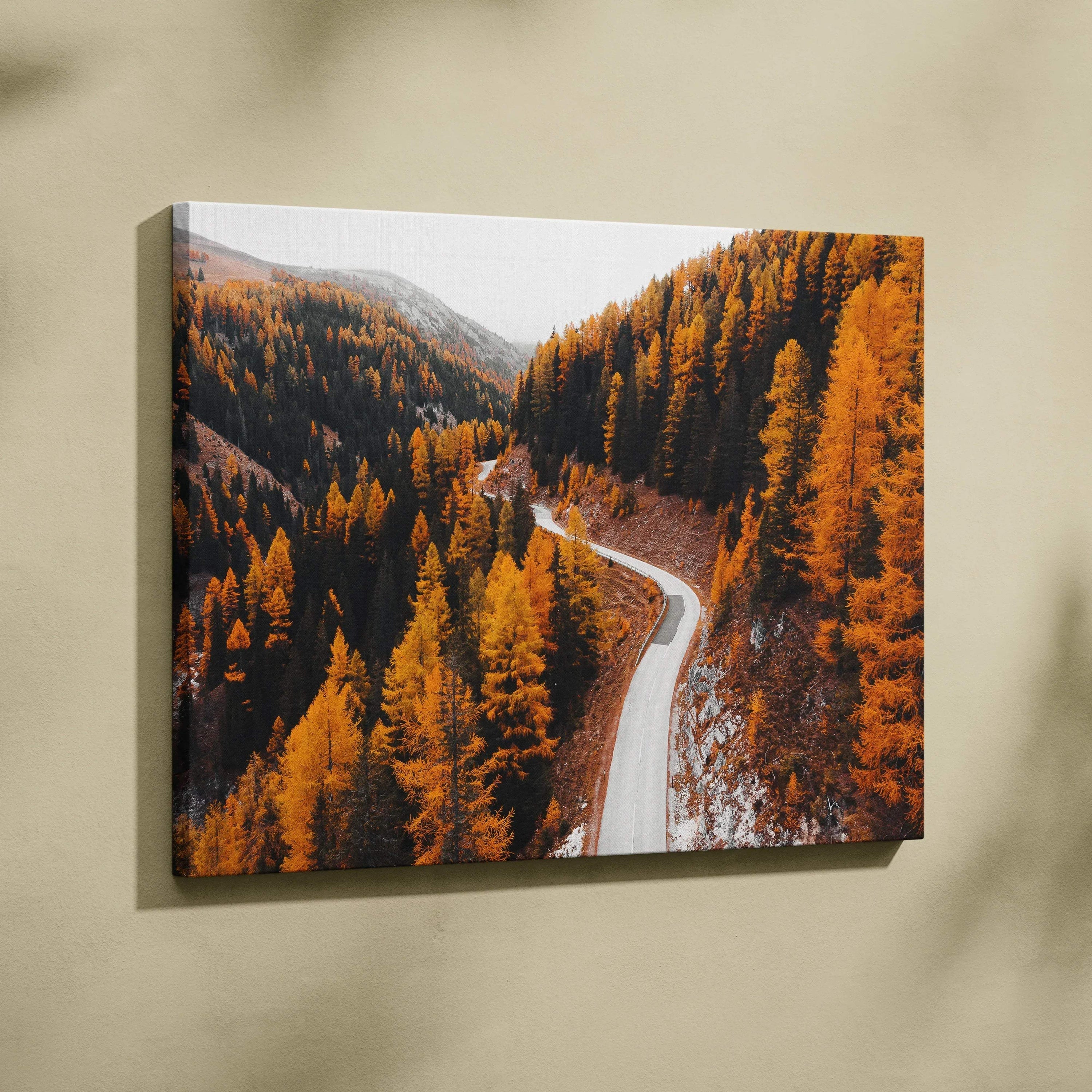 Autumn landscape canvas wall art with winding road through vibrant orange and yellow fall trees.