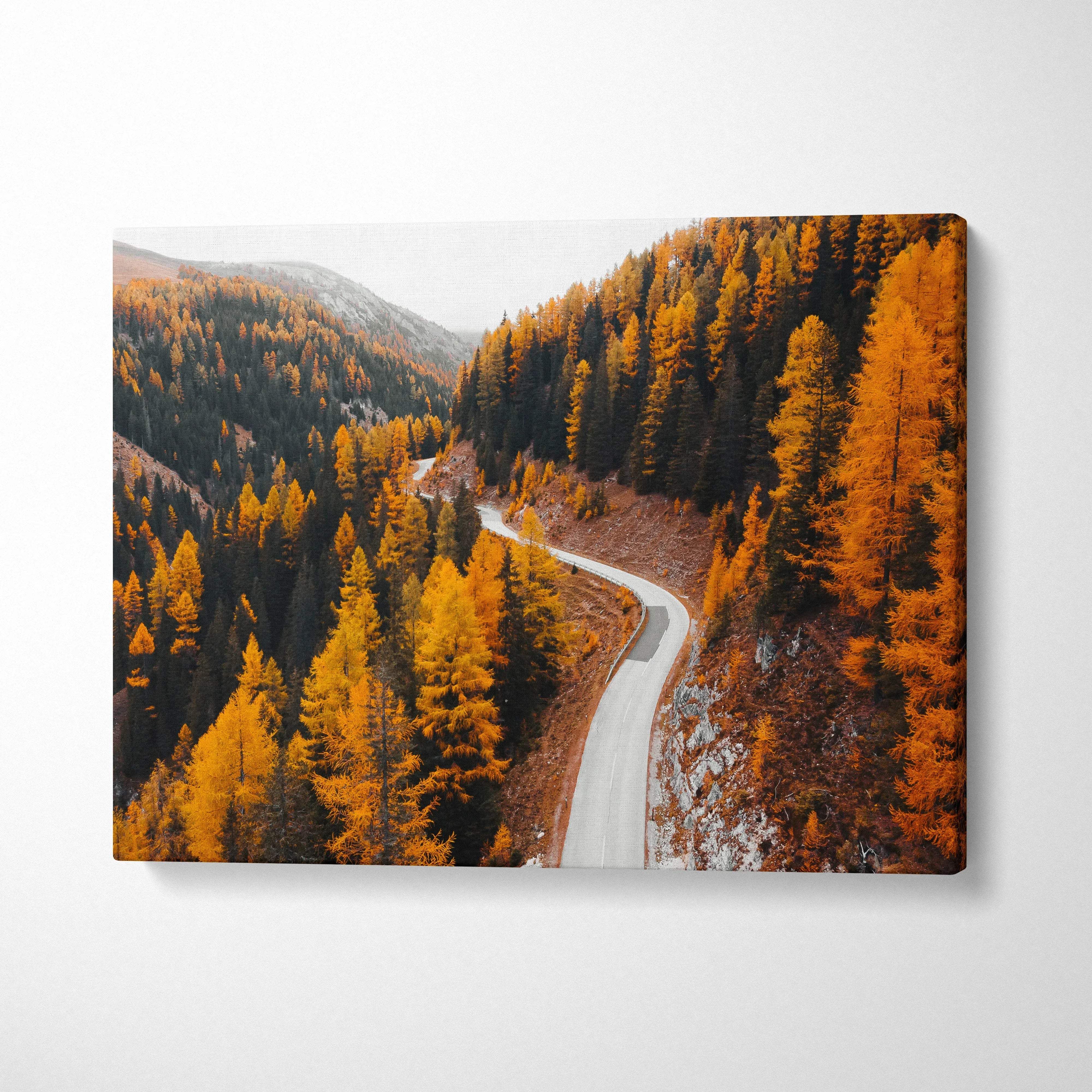 Autumn landscape canvas art with winding road and vibrant orange and yellow fall foliage wall art.