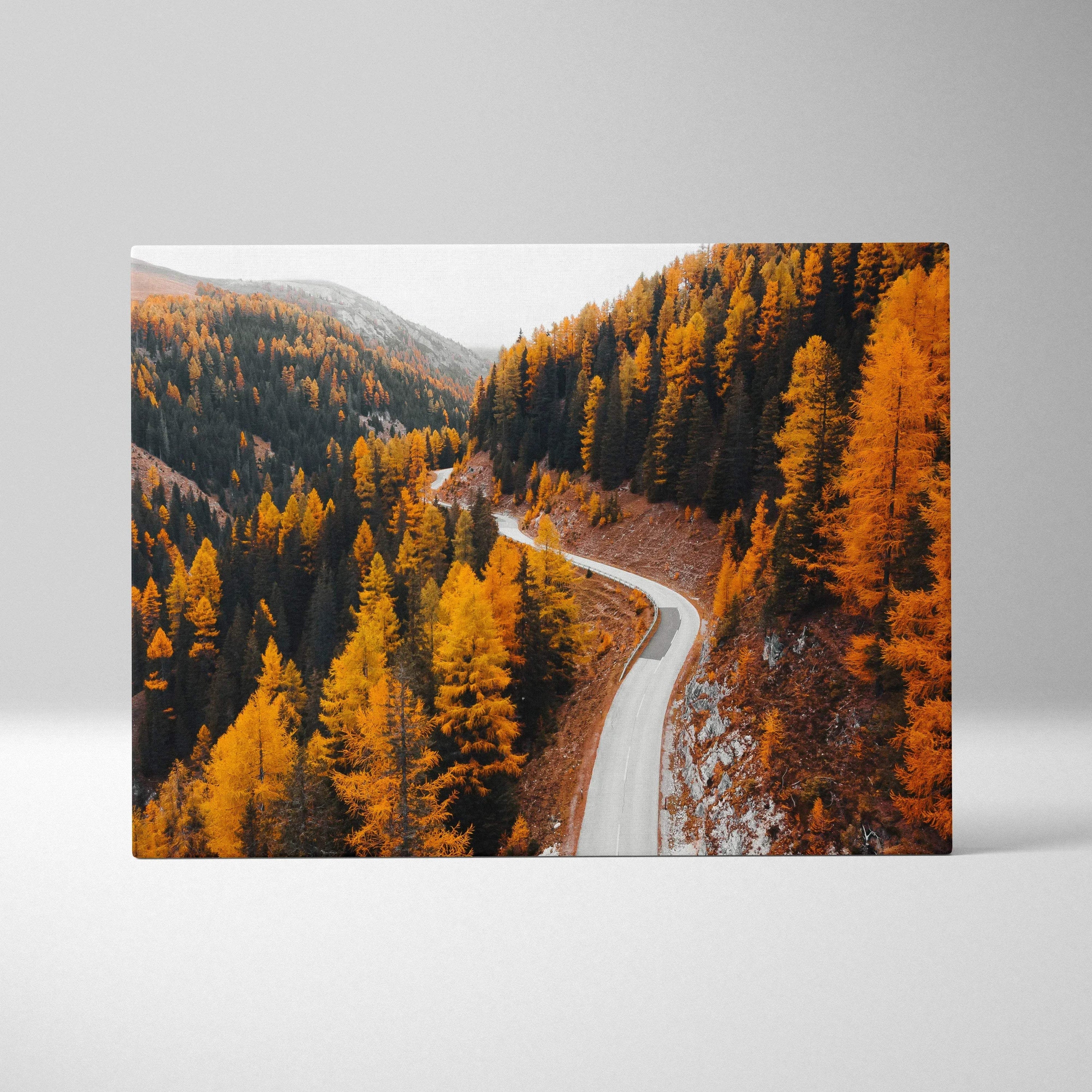 Autumn landscape canvas art with winding road through vibrant orange and yellow fall foliage wall art.