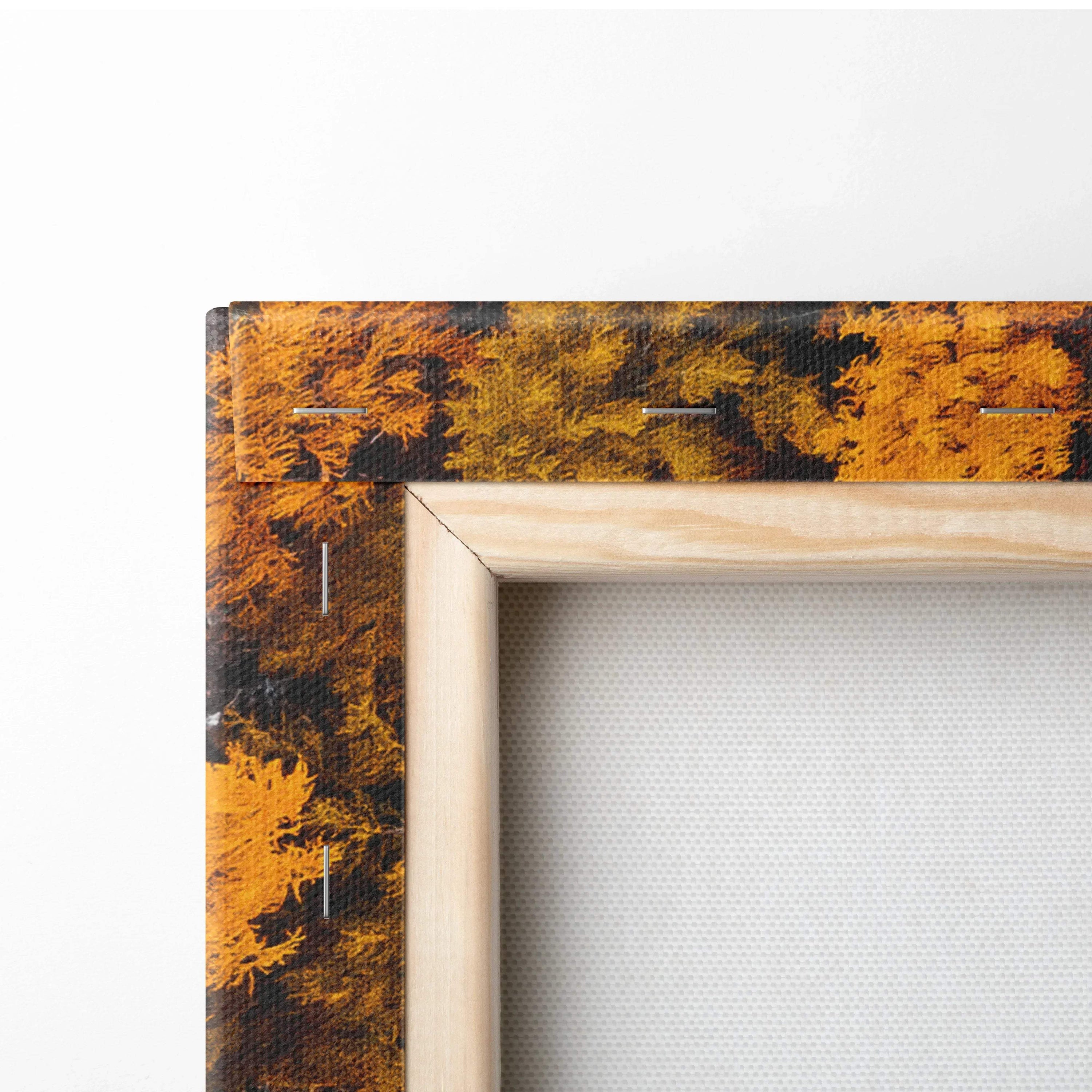 Close-up of canvas art showing wooden frame and vibrant autumn foliage design for wall art.