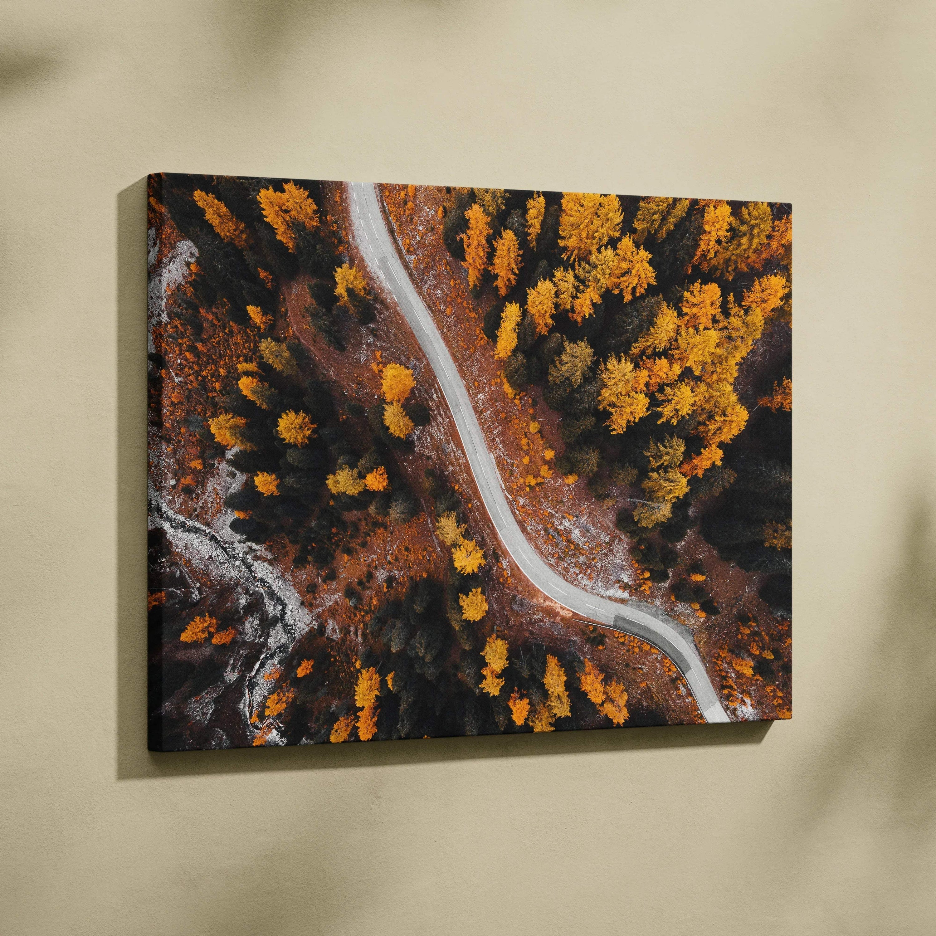 Canvas art featuring a serene winding road through golden autumn foliage, vibrant fall wall art.