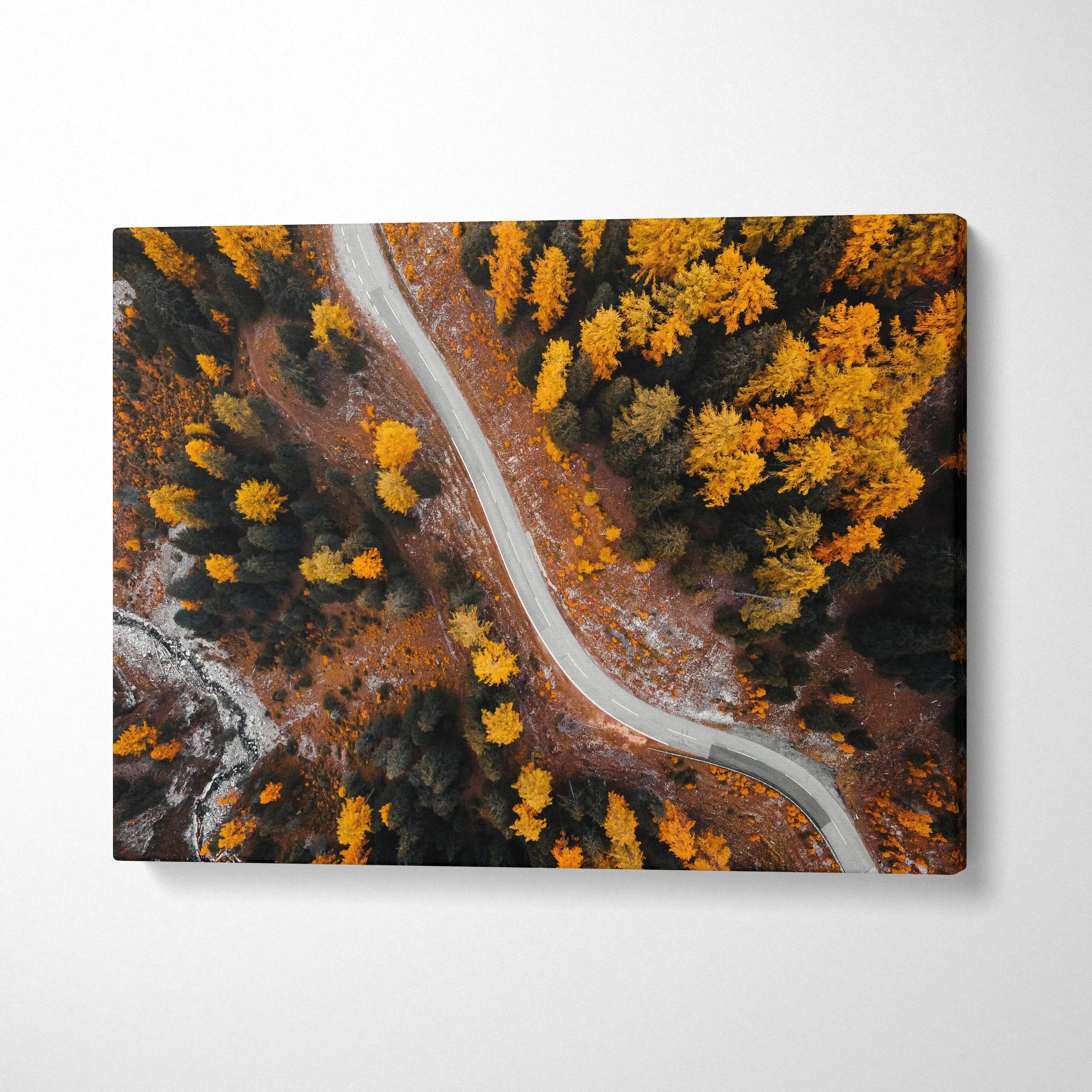 Canvas art of winding road through dense golden autumn forest, vibrant fall wall art.
